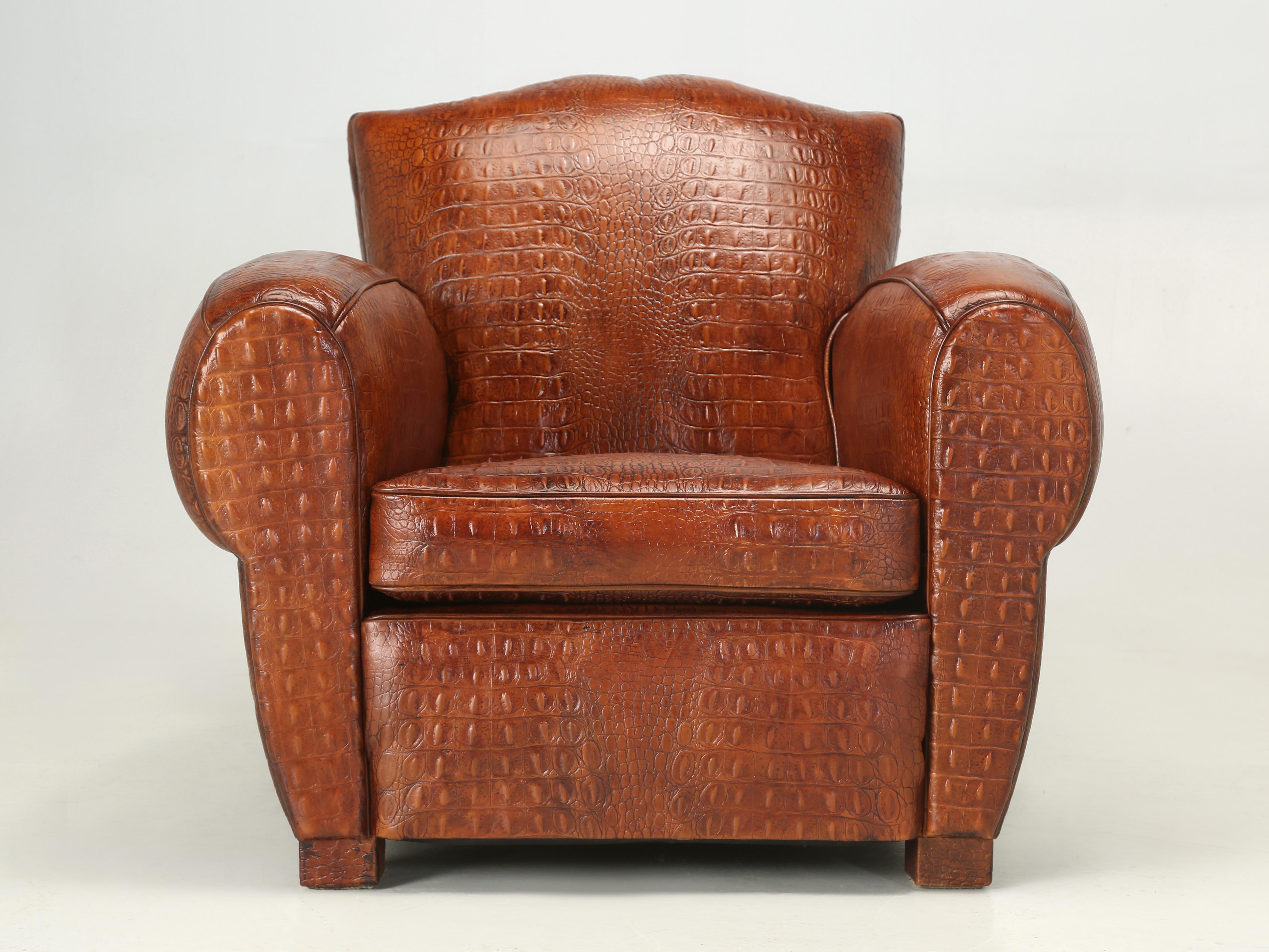 French Art Deco Moustache Style Leather Club Chair Upholstered in a Gorgeous Aged Cognac Colored Faux Crocodile Real Leather imported from Italy and surprisingly soft for an embossed leather. We were inspired by our Original Crocodile 1920’s Club