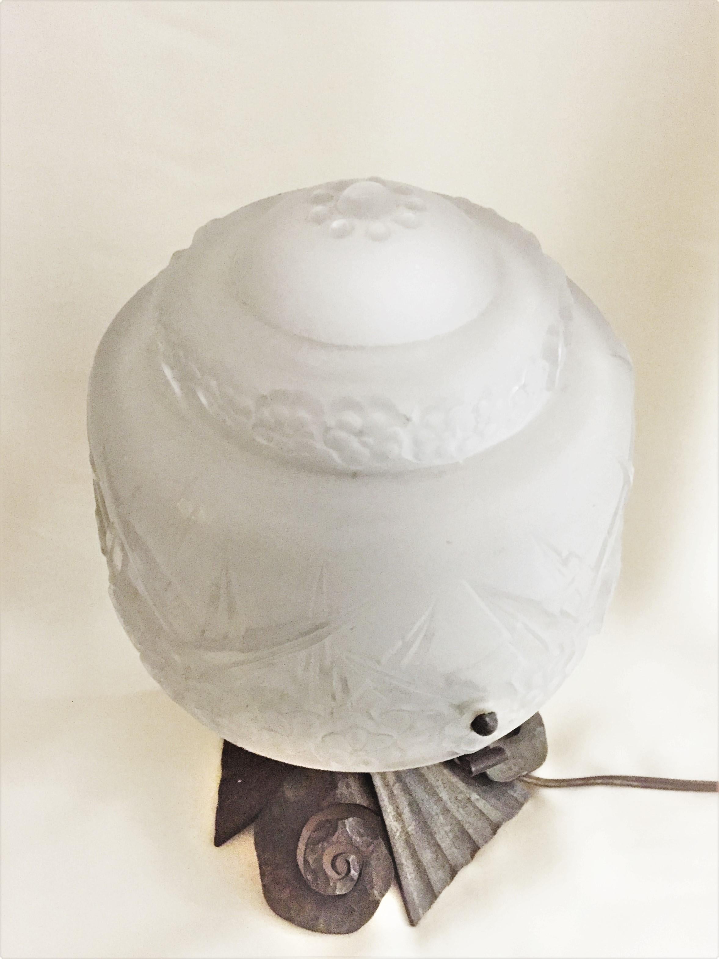 Dimensions:
Height (total): 11-3/4 inches
Height (glass lampshade only): 5-3/4 inches
Diameter (glass lampshade): 7 inches
Width (bronze base): 7-1/4 inches

Bronze stand, possibly, by Edgar William Brandt (1880–1960), who was a French iron worker,