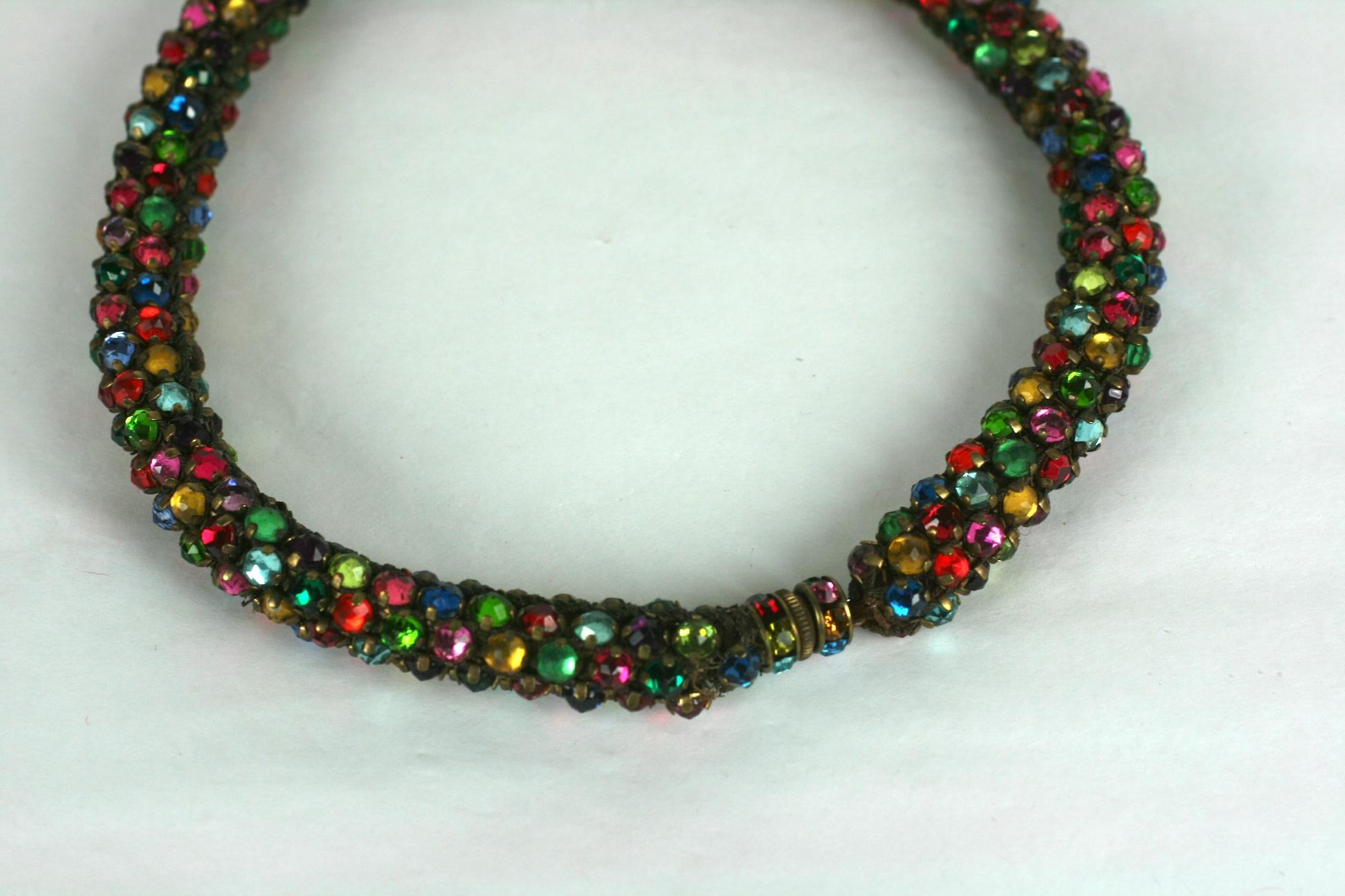 French Art Deco Multicolored Paste Collar from the 1920's. Hundreds of multicolored prong set pastes are sewn onto a gilt lame textile rope which makes it soft and pliable. Screw clasp is set with pastes as well.  1920's France.  Smaller size, 14