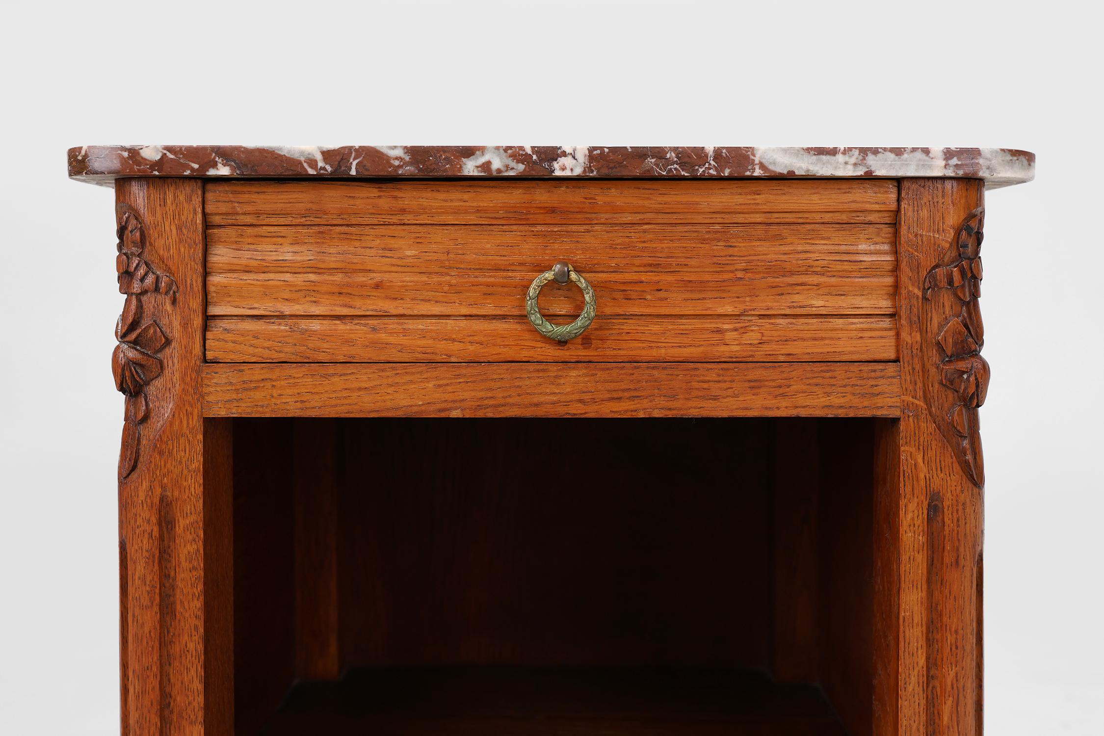 Carved French Art Deco nightstand in oak with marble top, 1930s For Sale