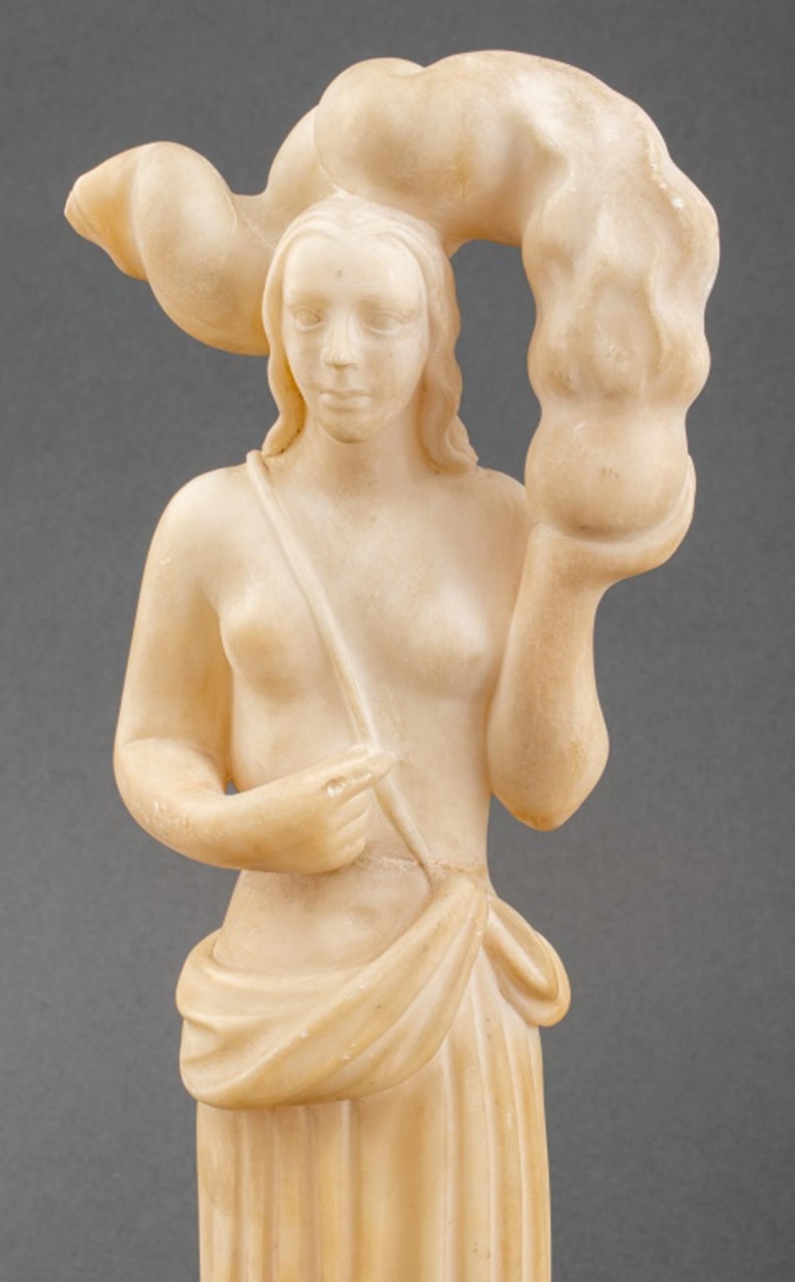 French Art Deco alabaster stone sculpture depicting a standing half-nude woman holding a vessel aflame, mounted upon a square marble base.

Dimensions: Overall: 13.5