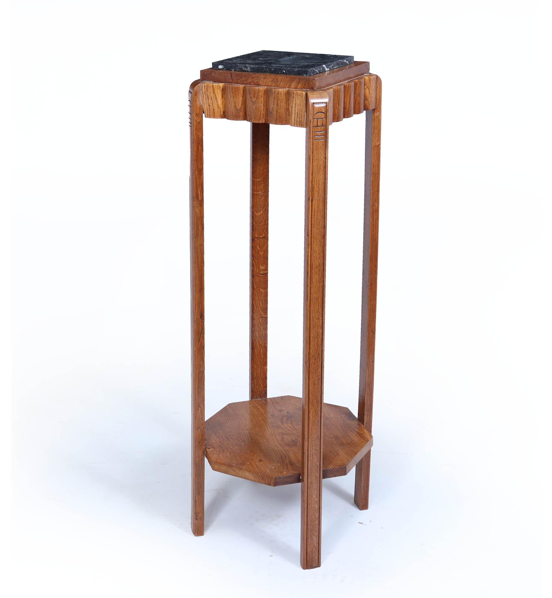 French Art Deco Oak Plant Stand
A French Art Deco plant stand formed from solid oak with marble top, and octagonal shelf below the stand has been fully polished by hand.

Age: 1940

Style: French Art Deco

Origin : France

Material: Oak

Condition: