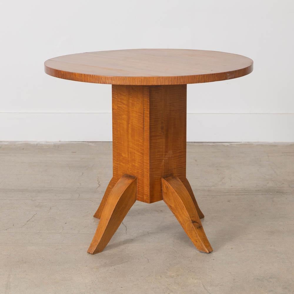 Lovely Art Deco side table from France, 1930s. Circular top rests on a base with four curved feet. Original finish shows nice natural grain, age, and patina. 