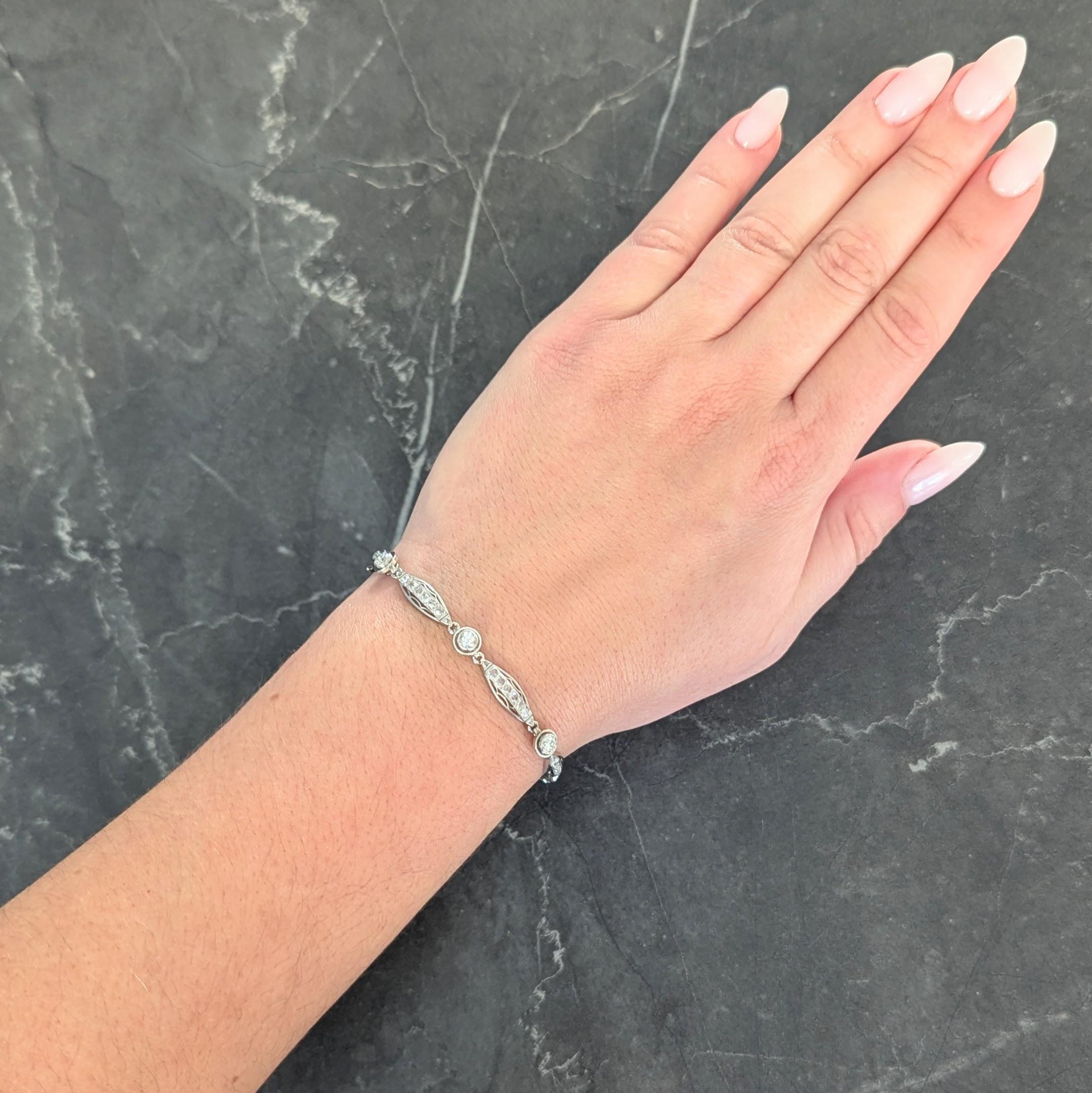 Comprised of pierced round and navette shaped links alternating in pattern
Round links each center bezel set old European cut diamonds
Weighing approximately 1.12 carats total - G/H color with VS2 clarity
Navette shaped links center rows of bead set