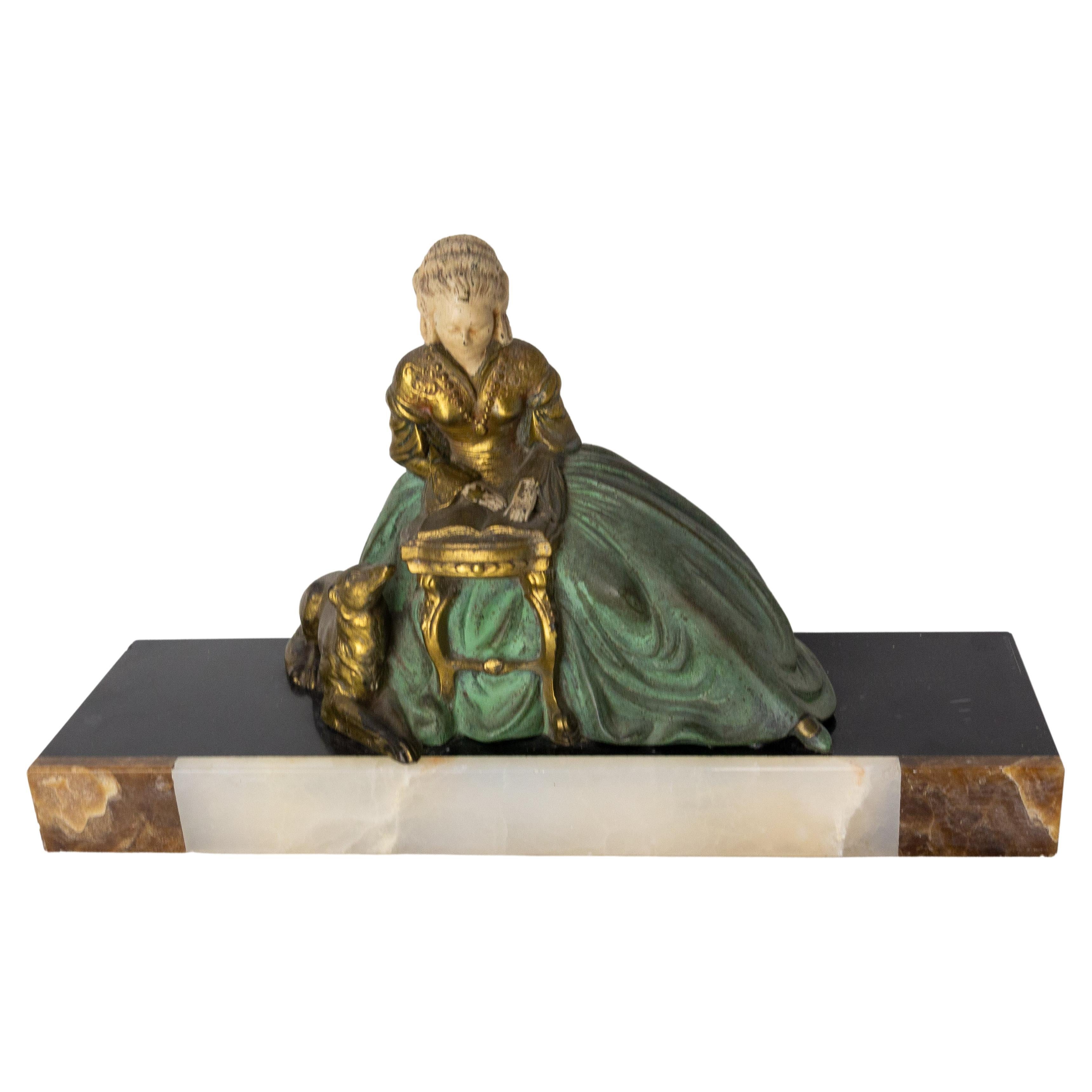 French Art Decospelter statue.
Different colors of onyx and polychomed spelter circa 1930
The scene reprensents a woman absorbed in his reading with her dog.
Good condition

Shipping:
P 10 / L 33.5 / H 19 cm 3.4 kg.
