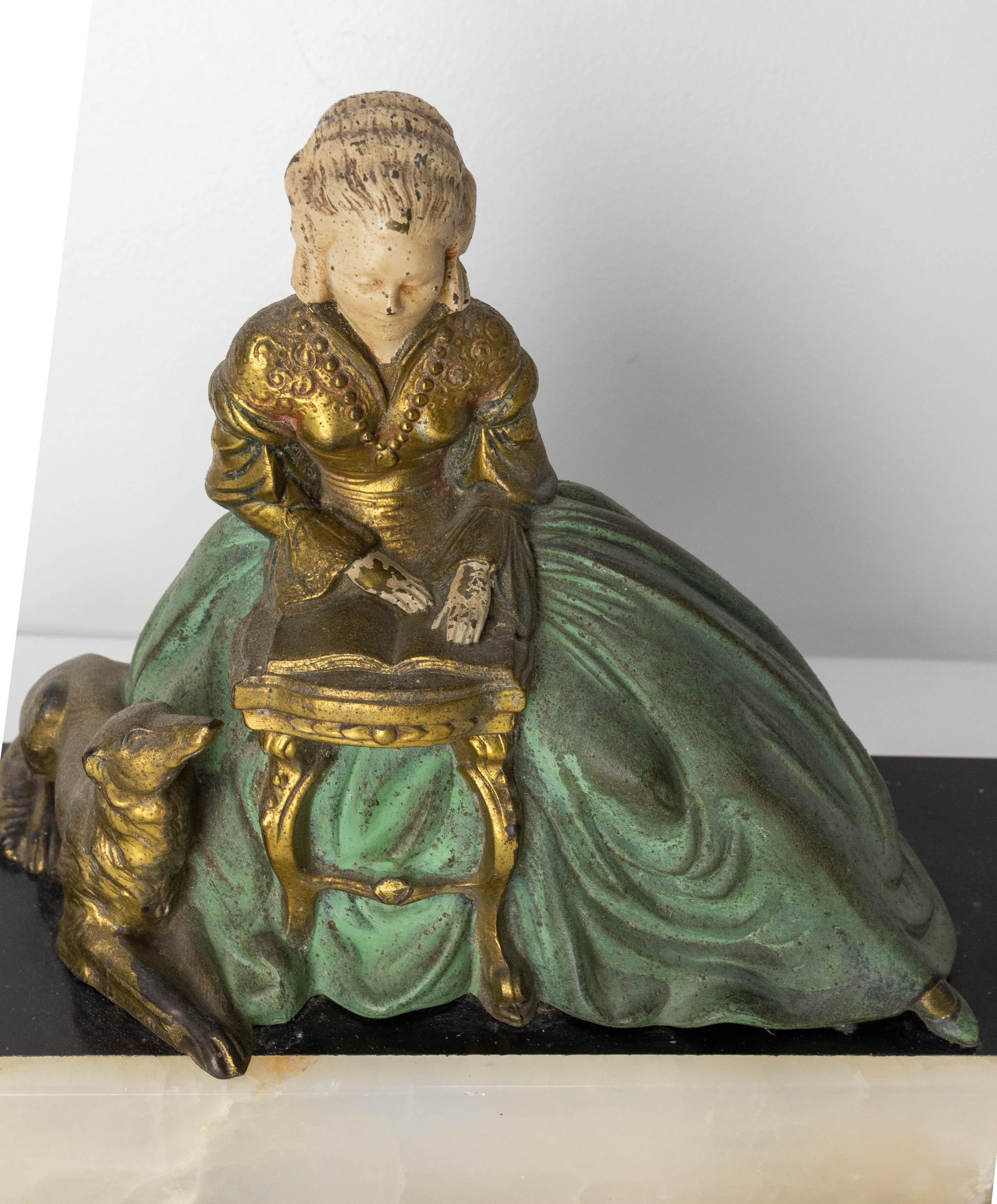 Mid-20th Century French Art Deco Onyx & Polychrome Spelter Reading Woman with Dog, circa 1930 For Sale