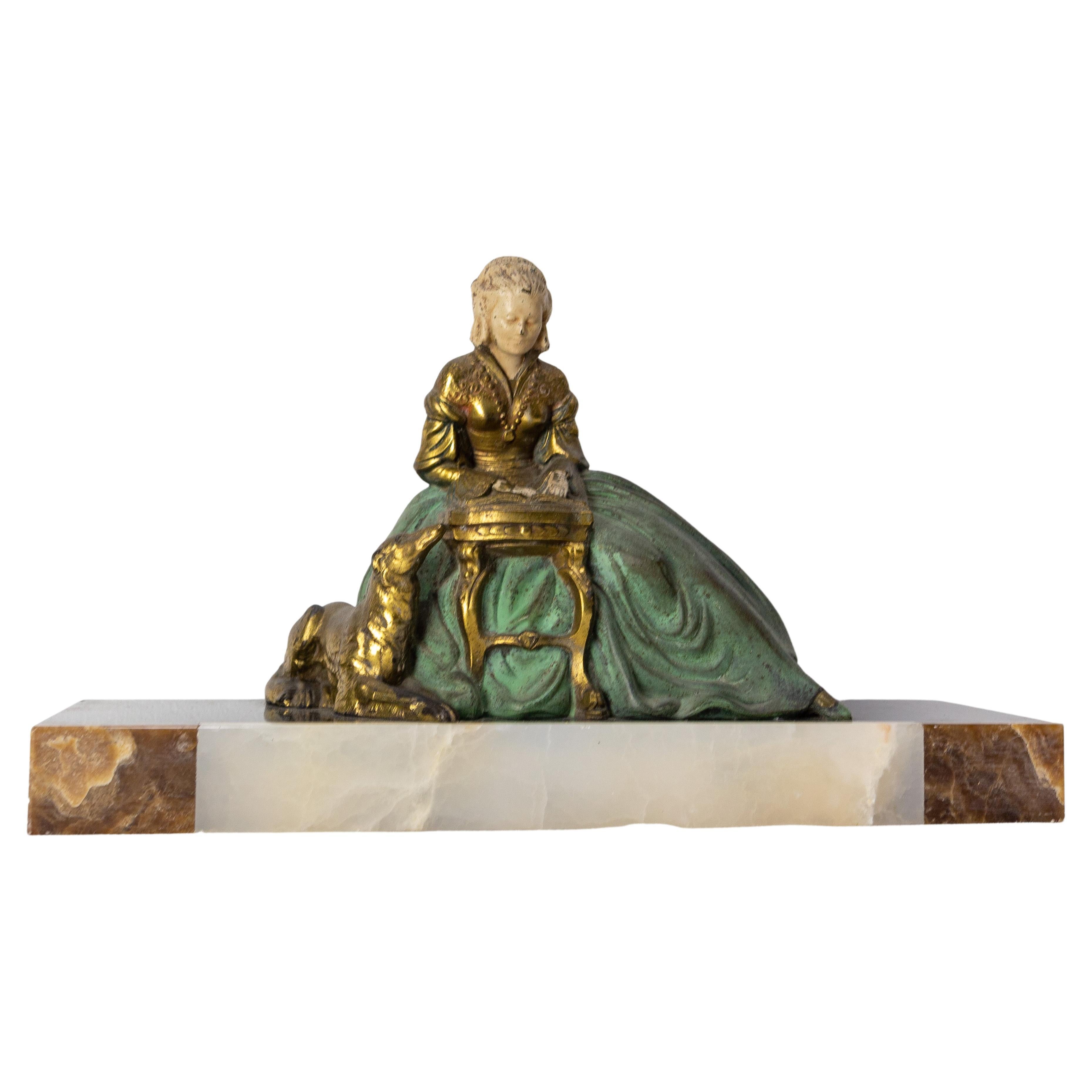 French Art Deco Onyx & Polychrome Spelter Reading Woman with Dog, circa 1930 For Sale