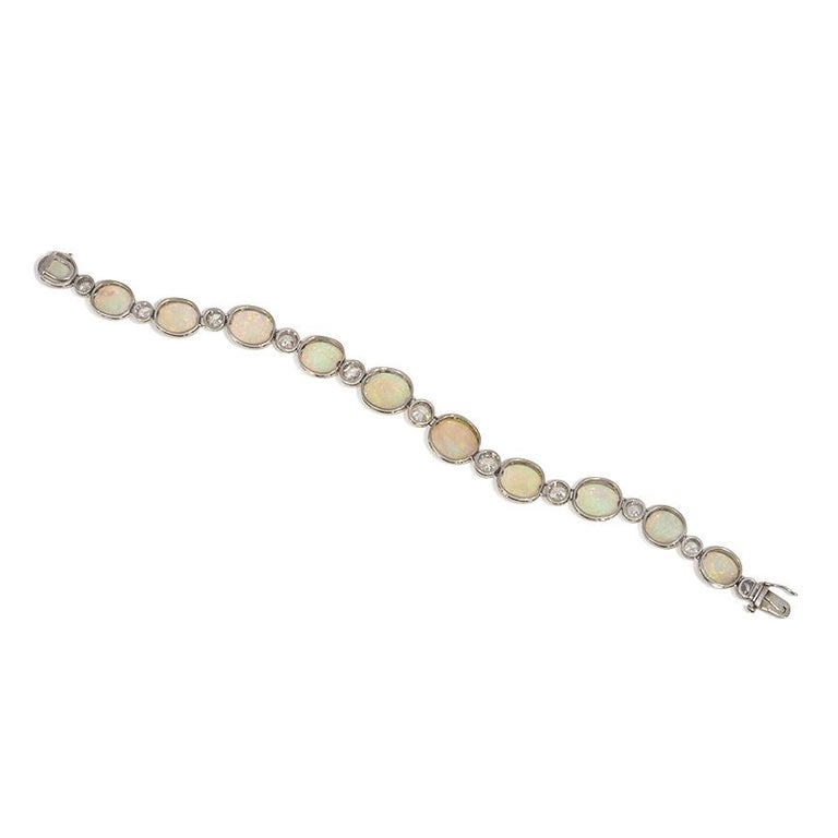 French Art Deco Opal, Diamond, and Platinum Line Bracelet In Good Condition For Sale In New York, NY
