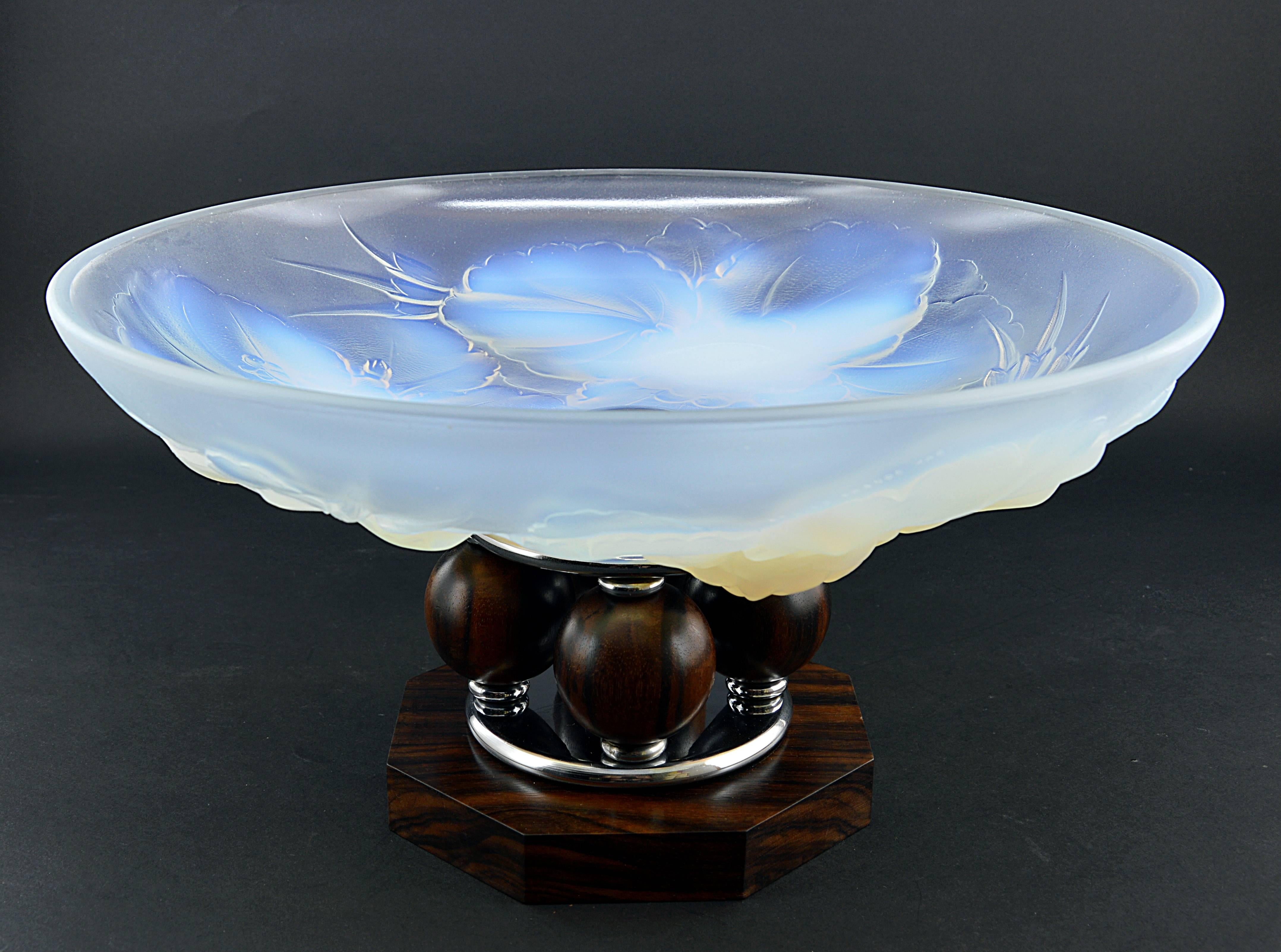 Thick opalescent molded glass bowl on a Macassar ebony and chromed metal base. The famous one with four Macassar balls. Molded signature 