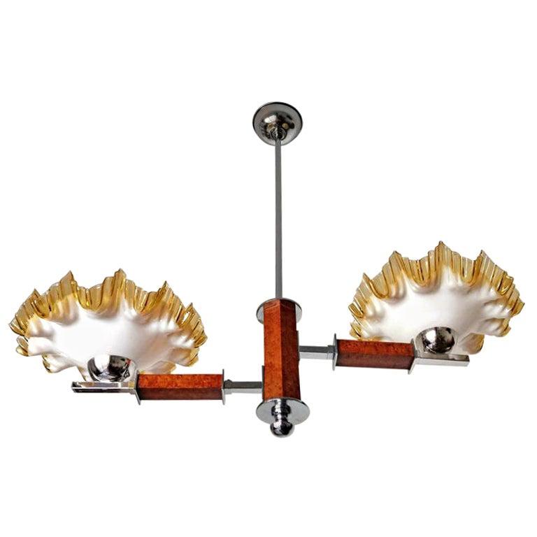 Fabulous Bauhaus French Art Deco with gorgeous opaline cased ruffled glass shades/chromed brass 2-light chandelier.
Measures:
Width 32 in/ 81 cm
Height 28.5 in/ 72 cm
Depth 11 in / 28 cm
Weight: 7 lb/ 3 Kg
2 light bulbs E27/ good working condition
