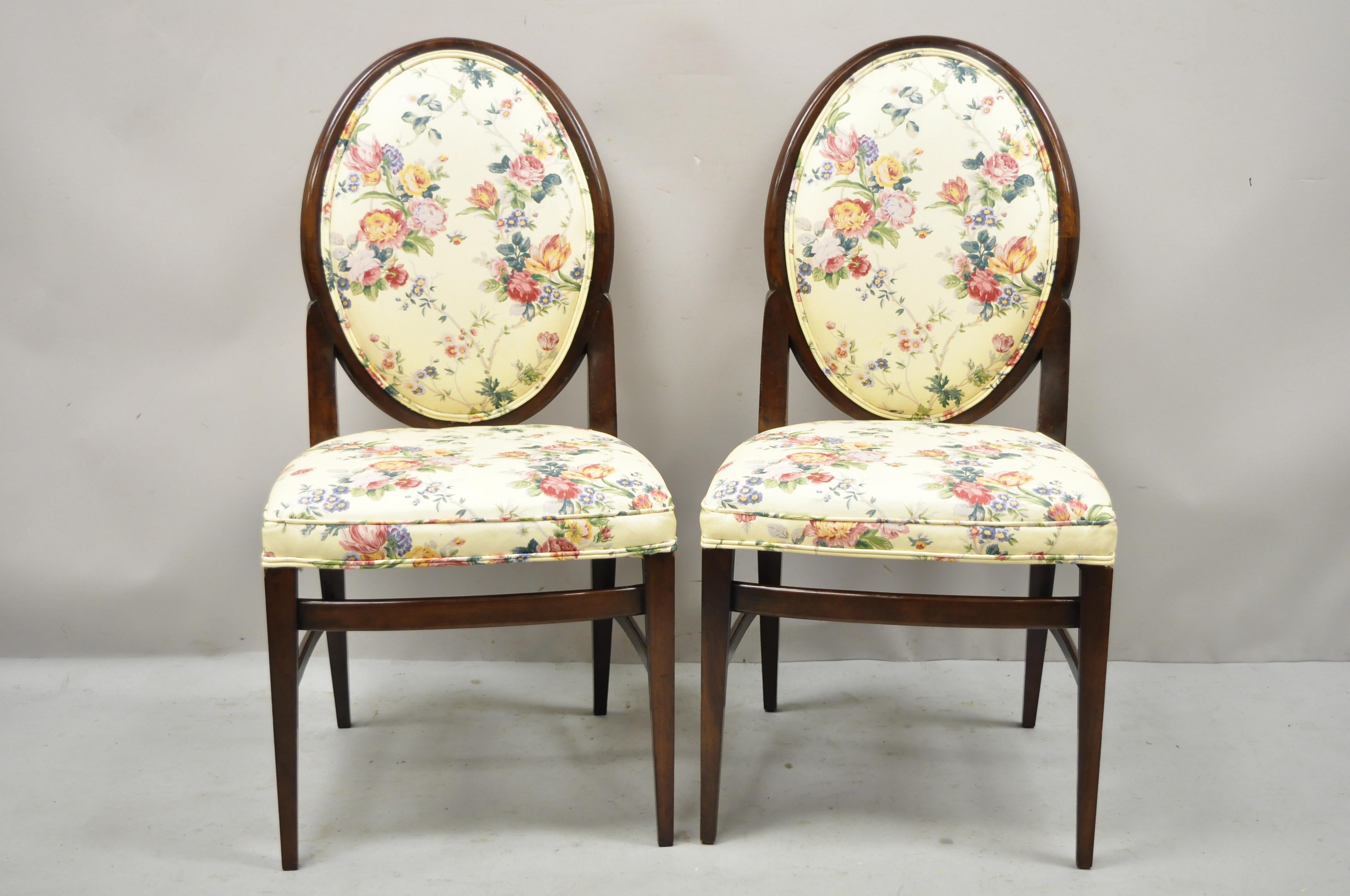 French Art Deco oval upholstered back mahogany wood frame dining chairs - a pair. Item features oval upholstered backs, solid wood frames, tapered legs, very nice vintage pair, clean modernist lines, great style and form. Circa mid 20th century.