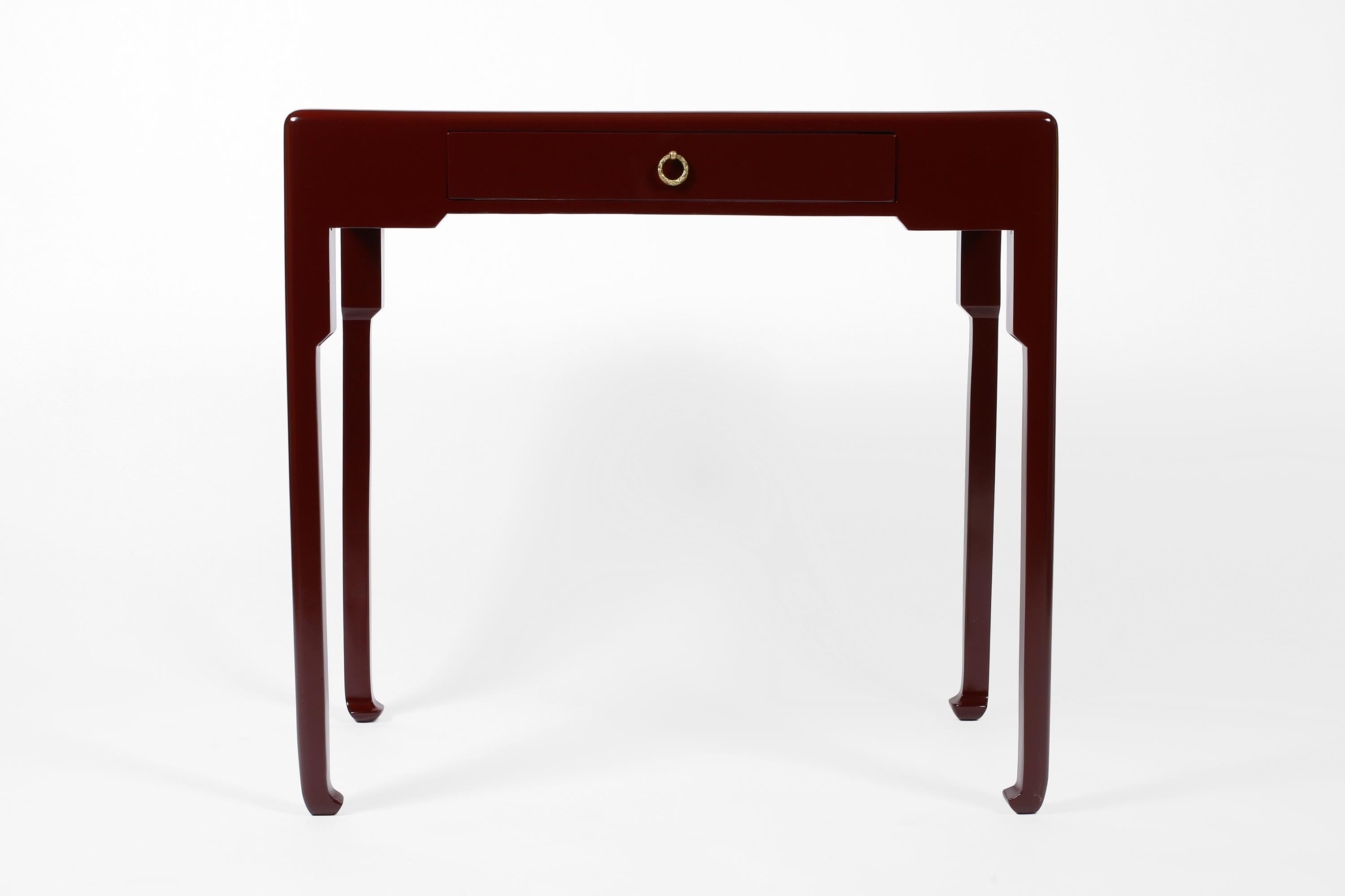 An Art Deco carved timber lamp table or small writing desk attributed to Paul Poiret for Atelier Martine. Featuring a single front drawer with decorative bronze ring pull and slender legs with typical eastern influence to the feet. Entirely finished