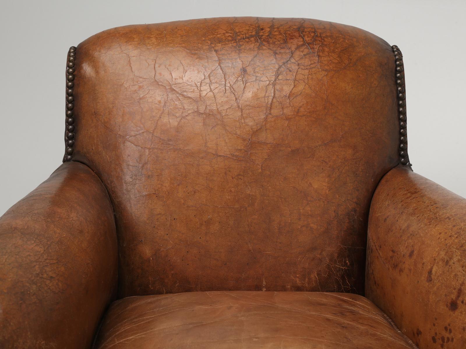 Beautiful and unusual at the same time, for although these French Art Deco leather club chairs are on the more petite scale, because of the way their arms are designed, a much larger person than you could image fits quite comfortably in these French