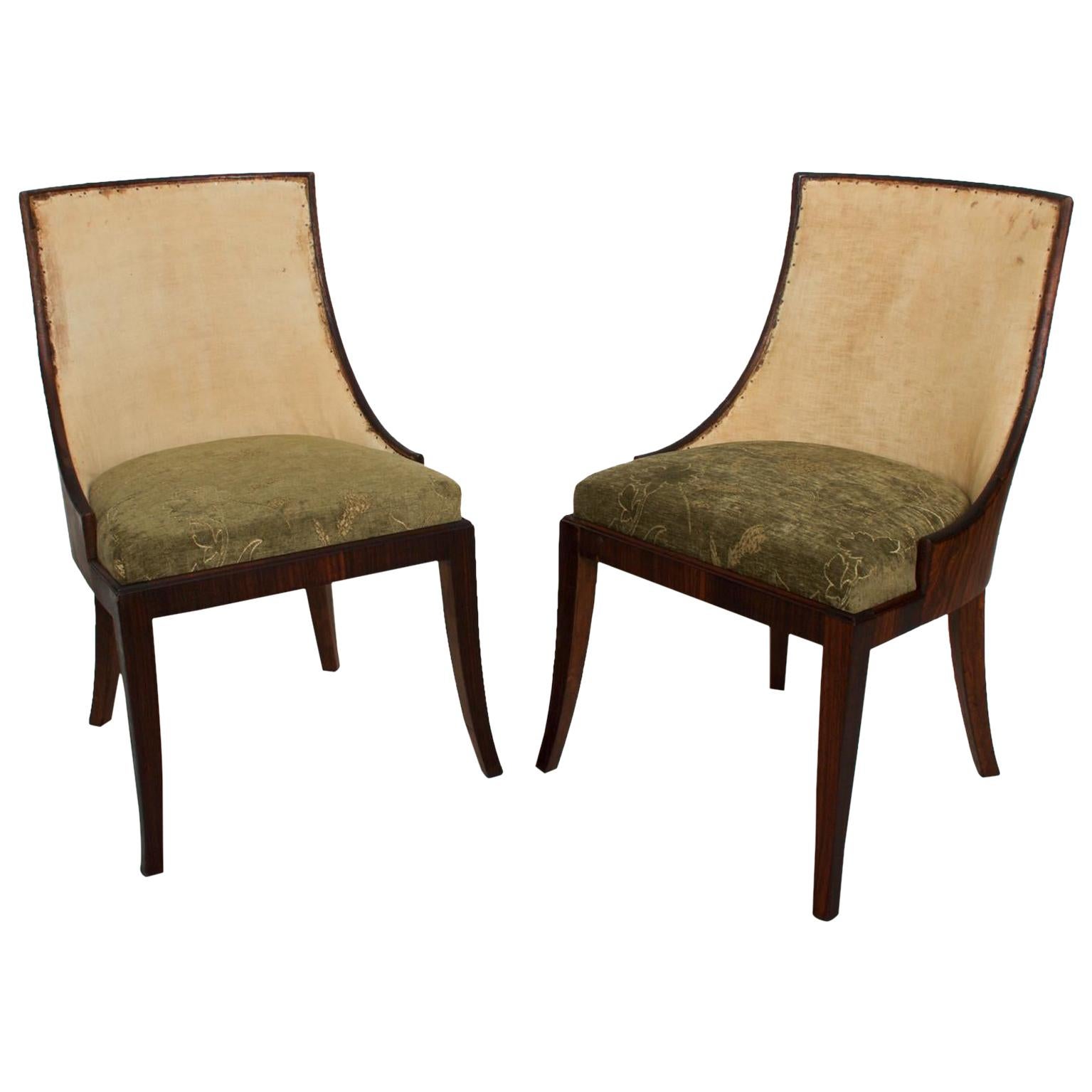 1940s Exquisite Pair of French Art Deco Rosewood Barrel Side Chairs 
In the style of Gilbert Rohde.
35 H x 24 D x 20.5 W Seat 19.5
No label.
Original Vintage Preowned unrestored condition.
Please see the images provided.
Delivery available to LA