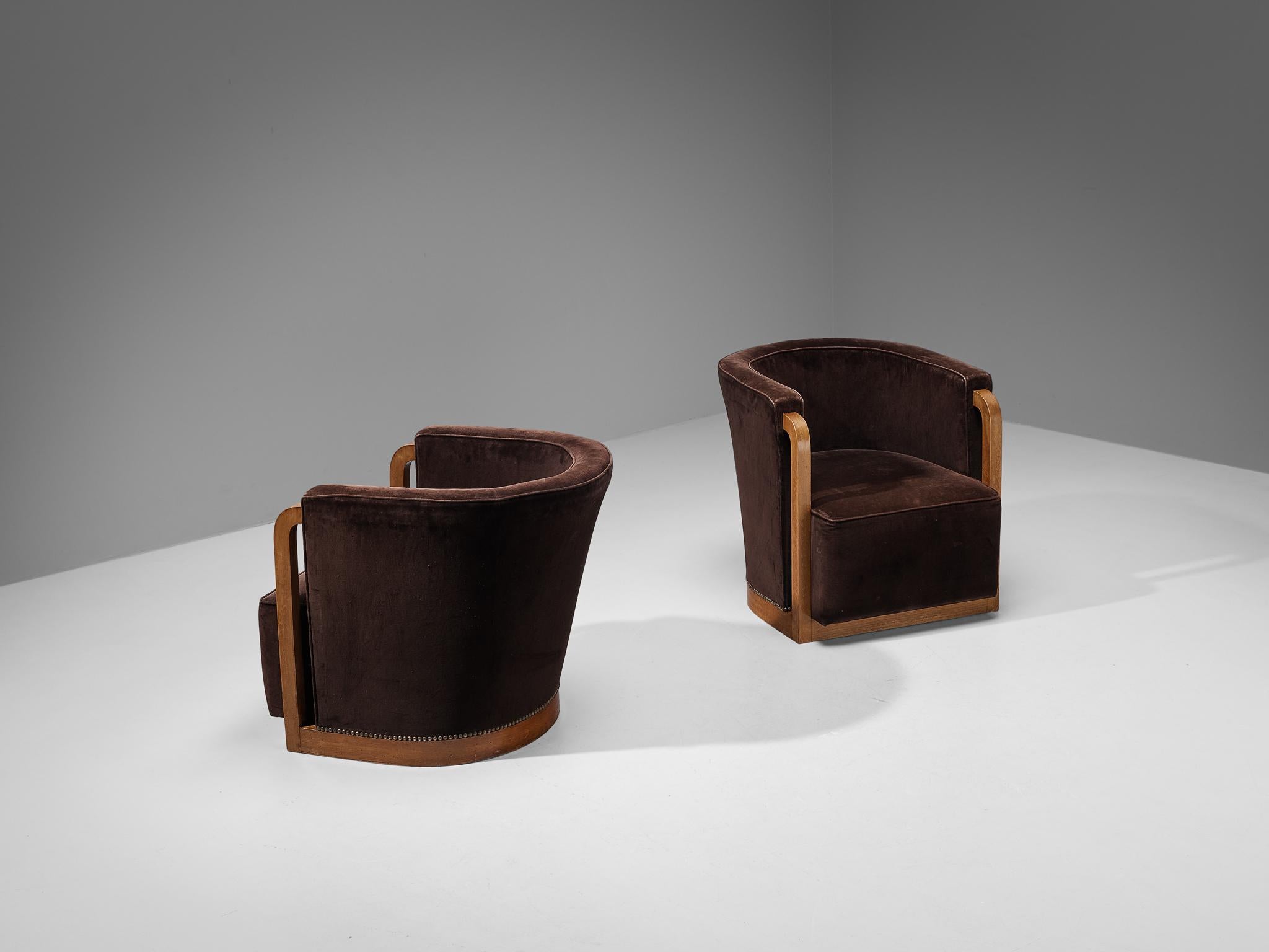 Pair of armchairs, stained beech, velvet, brass, France, circa 1930

These beautifully designed lounge chairs are created in one of the most influential periods for the arts namely the Art Deco Movement. These rare lounge chair originate from