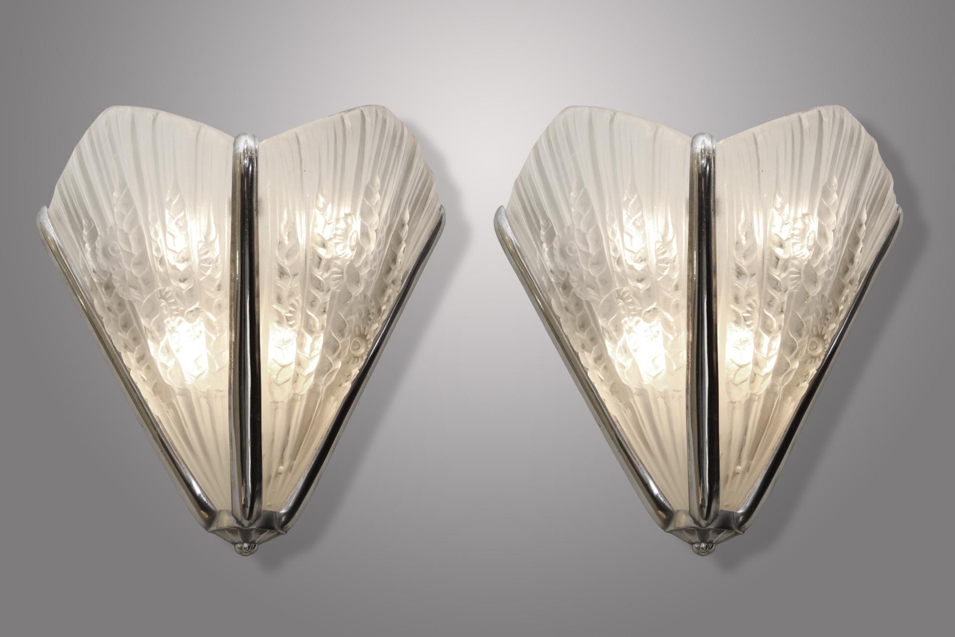Original French Art Deco pair of sconces by Genet & Michon in compressed glass and silver bronze base. This model is really spectacular by its volume which is really important. Double glass with wheat ears with flowers decor. Really impressive and