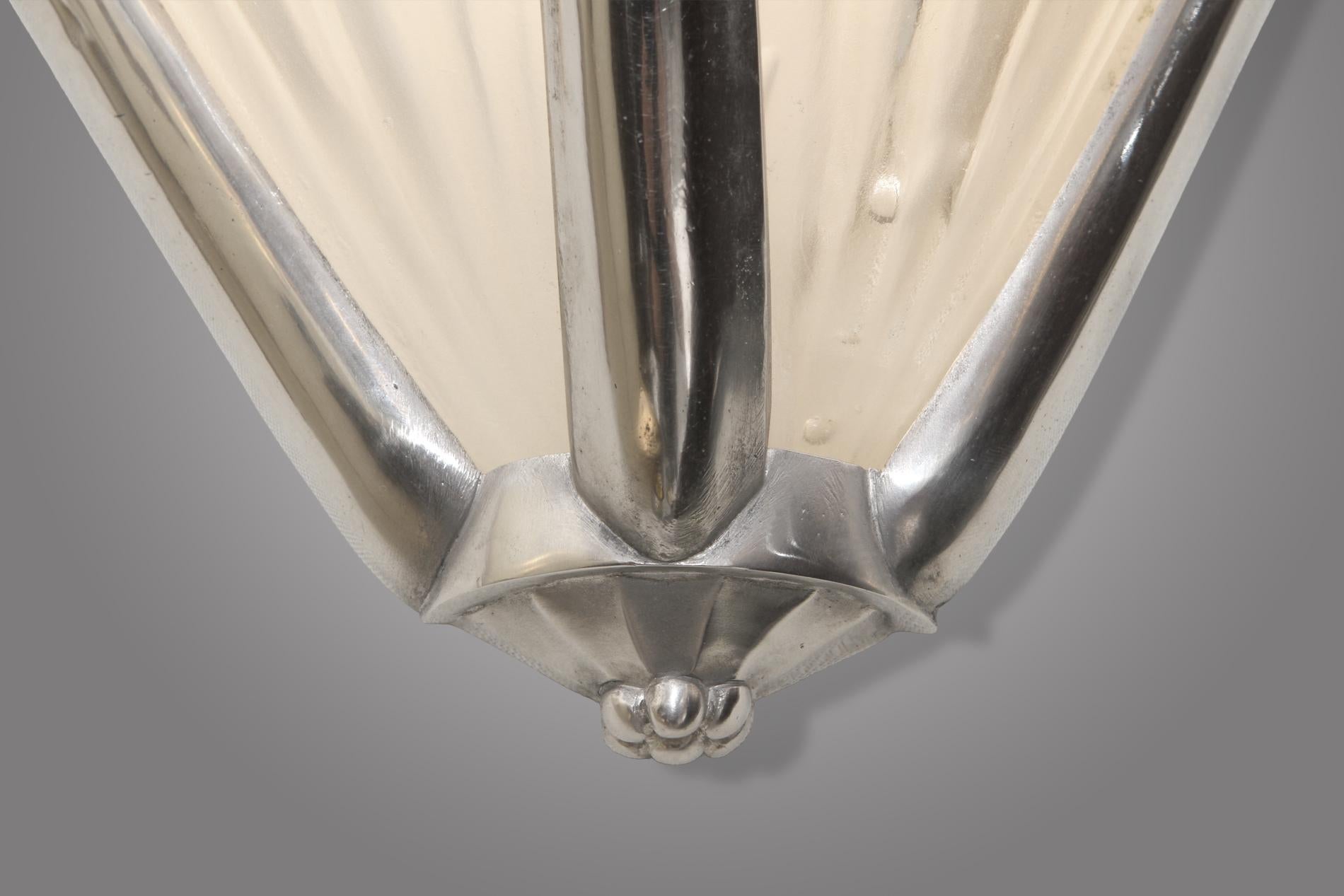 Bronze French Art Deco pair of sconces by Genet & Michon For Sale