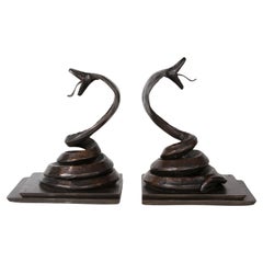 Used French Art Deco pair of snake bookends by Edgar Brandt 