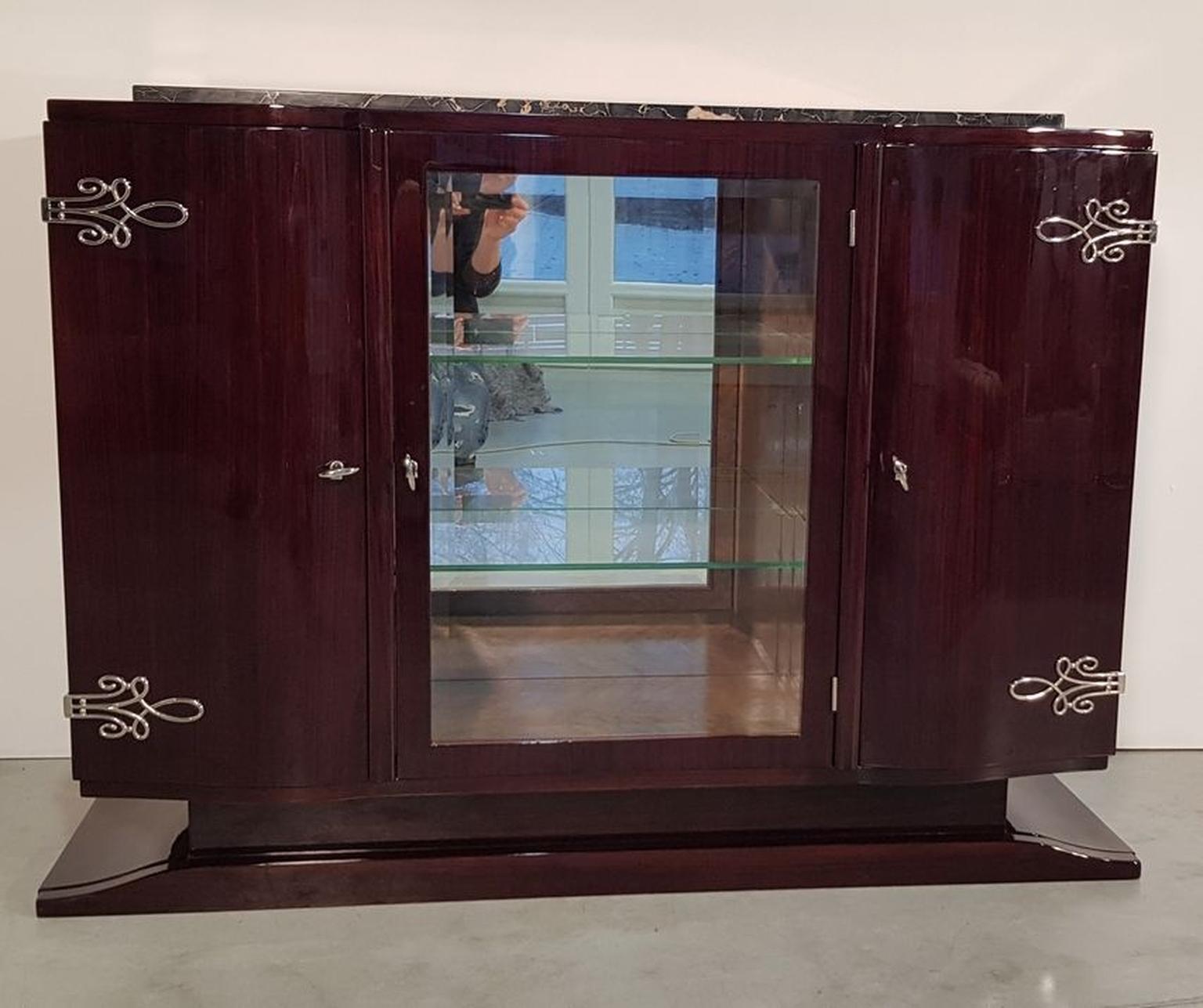 Amazing lacquered palisander sideboard with Portonero marble on the top and nickel-plated metal. There is a part with glass door, mirror and glass-shelves, inside bird eye maple veneer. France, 1930s. Recently restored.