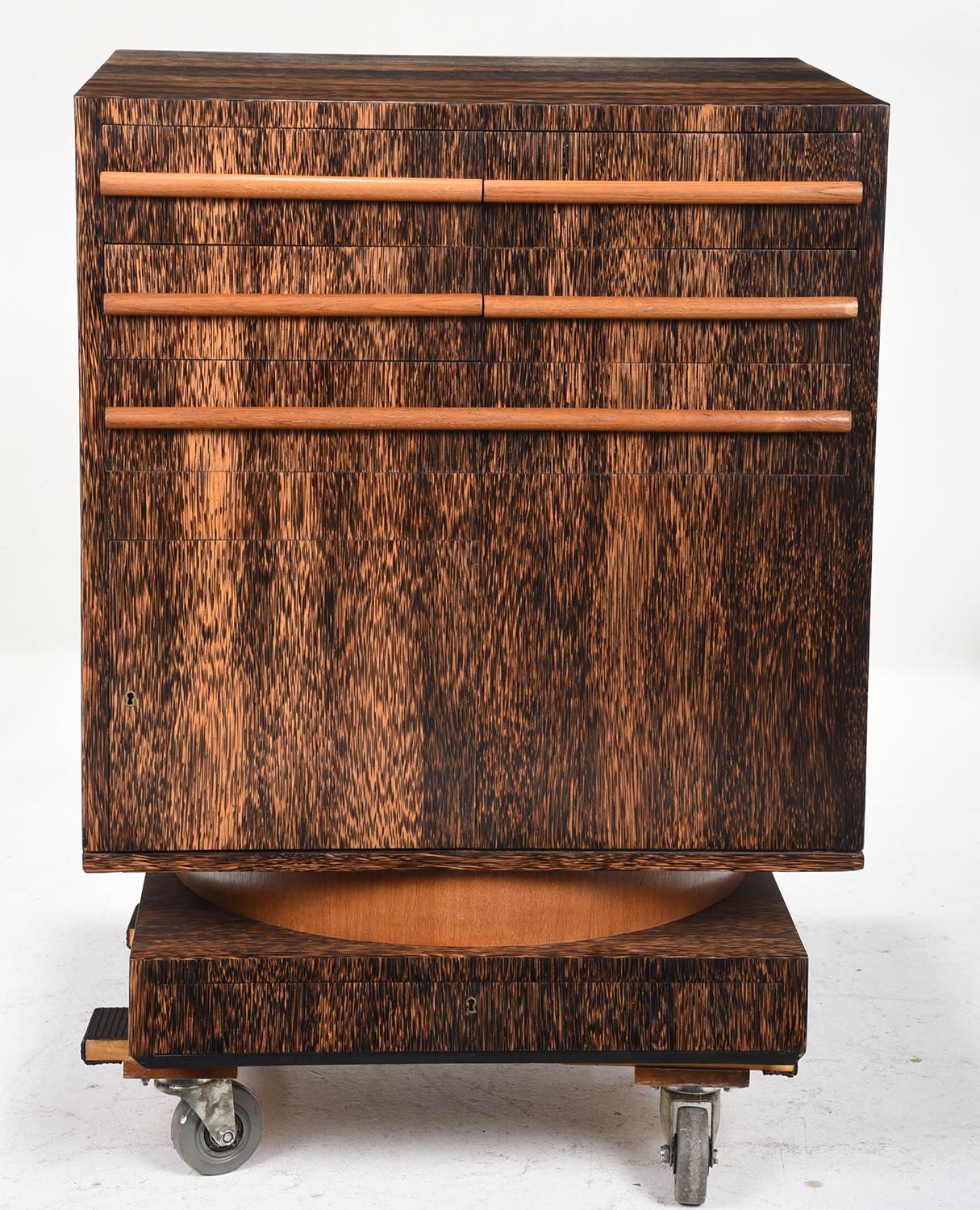 French Art Deco palmwood bar cabinet, featuring a fall front bar cabinet on one side, a second side with fall front lower cabinet with fitted interior and a third side fitted with drawers over cabinet door with two additional interior drawers.