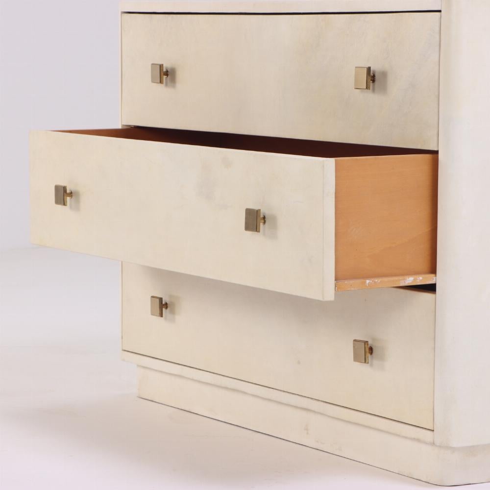 The case has three long drawers with brass square hardware all floating on a recessed base. 

Samuel Marx was an American architect and designer.