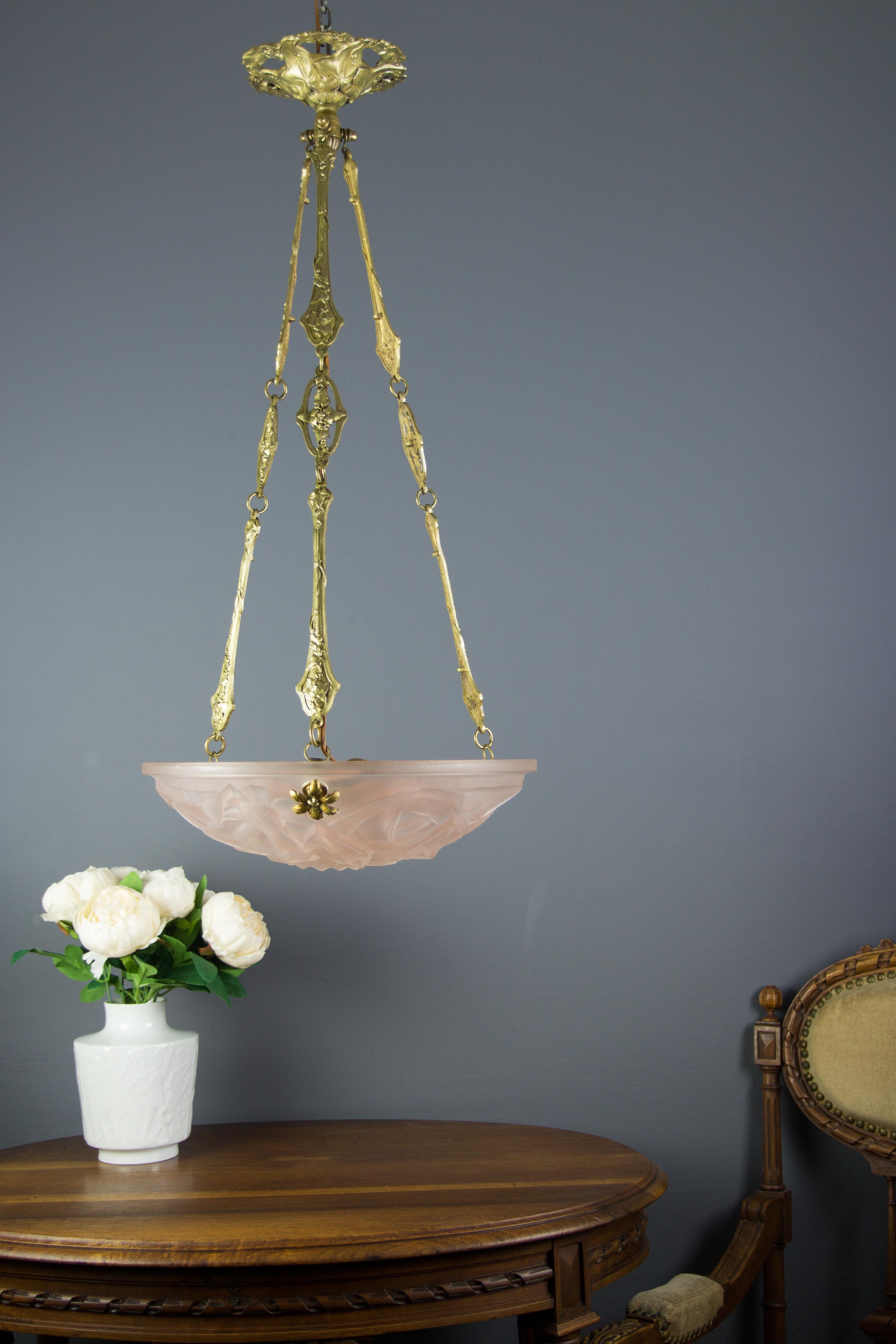 Beautiful French Art Deco pendant light/chandelier with frosted pressed glass shade by Degué, founded by David Guéron (1892 -1950), who specialized in luxury glassware including chandeliers. Beautifully shaped pastel pink glass bowl features
