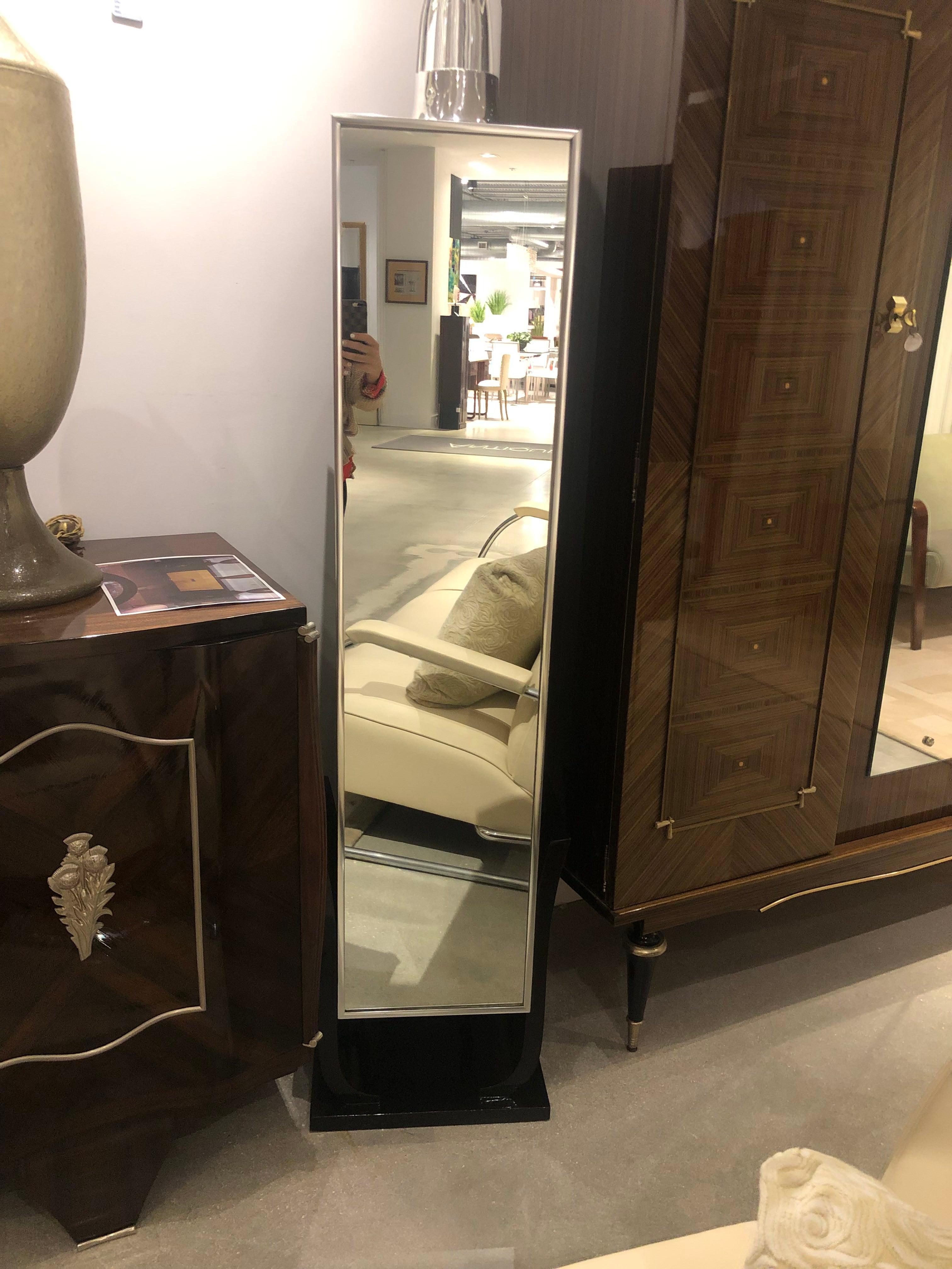 French Art Deco ebonized mahogany pedestal with mirror in front.