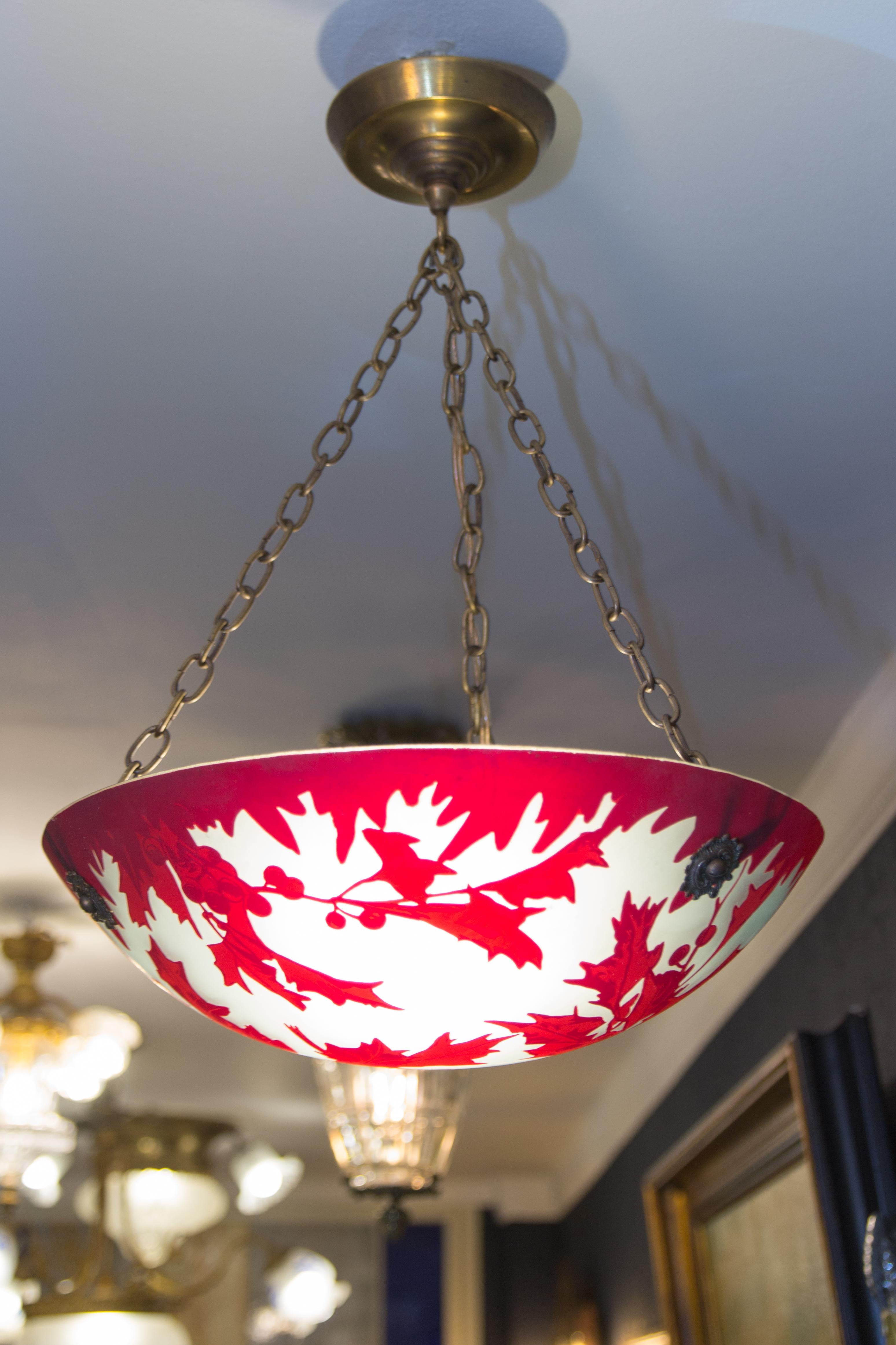 French Art Deco style pendant chandelier marked with Degue signature and red mistletoe leaves and berries on frosted glass. Brass and bronze fixture, one socket for E27 size light bulb.
Measures: Height is 20 inches / 50 cm; diameter - 13.3 inches /