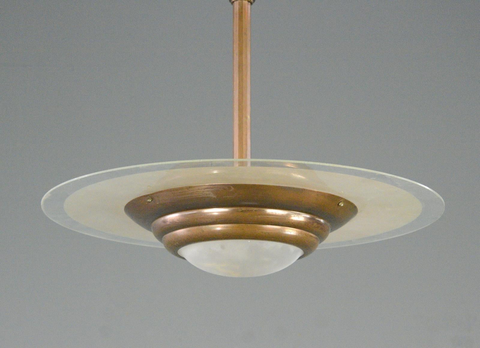 French Art Deco Pendant Light Circa 1920s

- Copper body and stem
- Large glass shade with acid etched rings
- Takes 3x E27 fitting bulbs
- French ~ 1920s
- 55cm wide x 51cm tall

Condition Report

Fully re wired with modern electrical components,