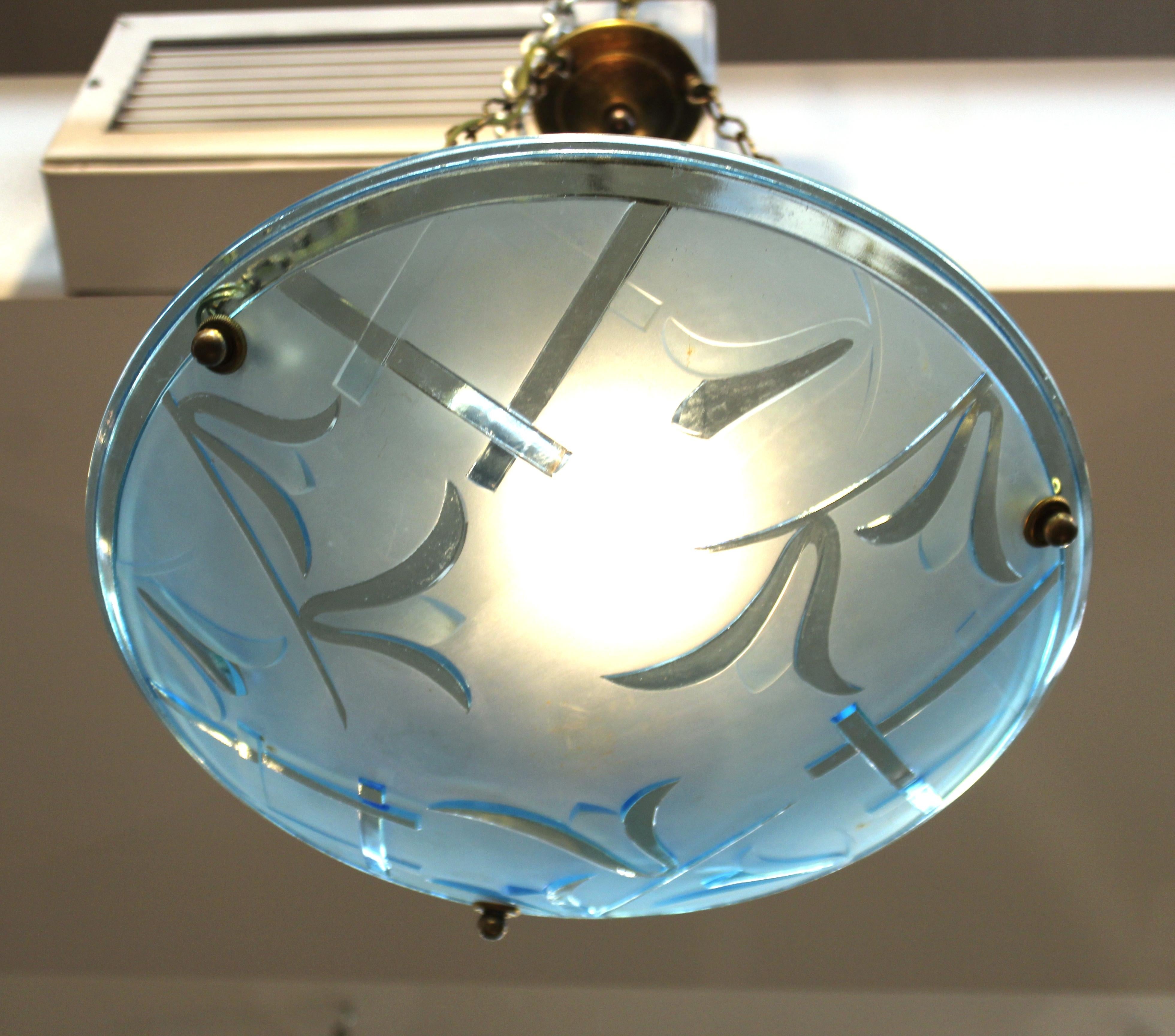 French Art Deco ceiling pendant with a decorative blue frosted and floral themed glass bowl. The piece is newly rewired and the bowl is suspended by three brass chains and a canopy piece. Never used before, in excellent vintage condition with