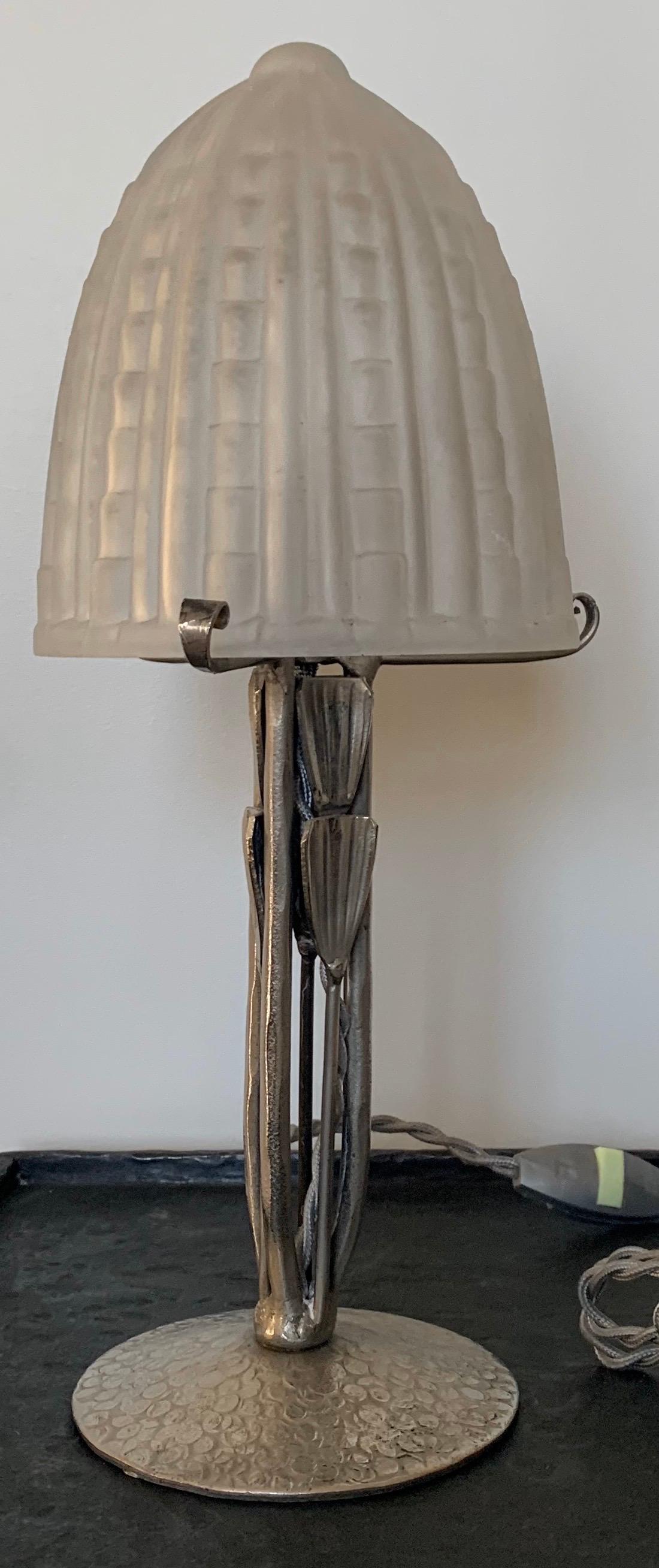 Petite French pewter Art Deco table lamp. Original frosted glass lampshade. Newly rewired with grey silk cord with side switch. Lamp takes one candelabra size bulb, max 60 watts. Bulb not included. Lamp is 9” tall without lampshade.