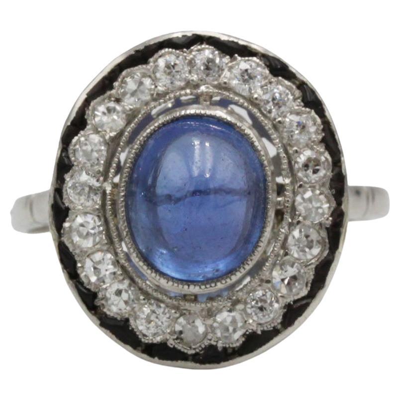 Anello Art Deco francese in platino con zaffiro cabochon e diamante
