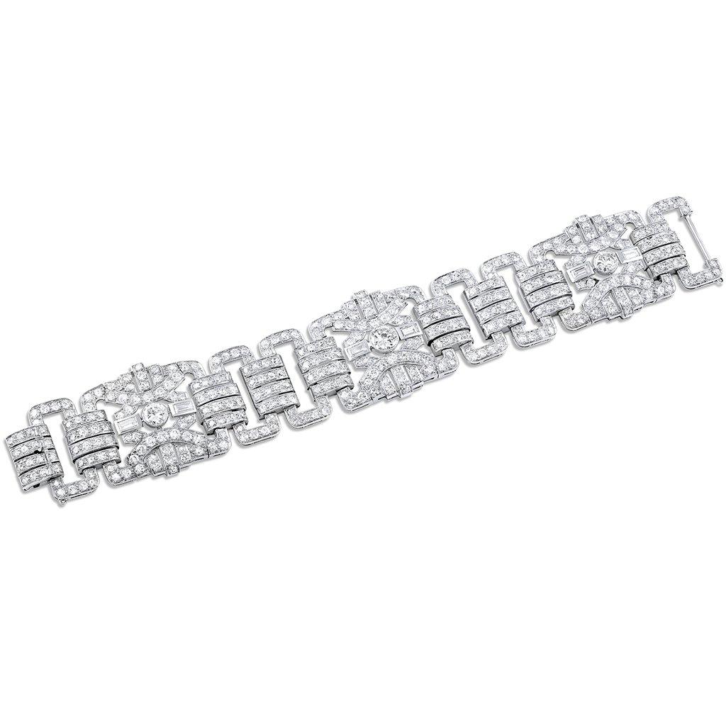 Estate French Art Deco Platinum Diamond Bracelet. This estate French platinum bracelet is set with diamonds in the favored Art Deco pattern. The center diamonds are of European cut, weighing a total of 1.35cttw with 2 side European cut diamonds