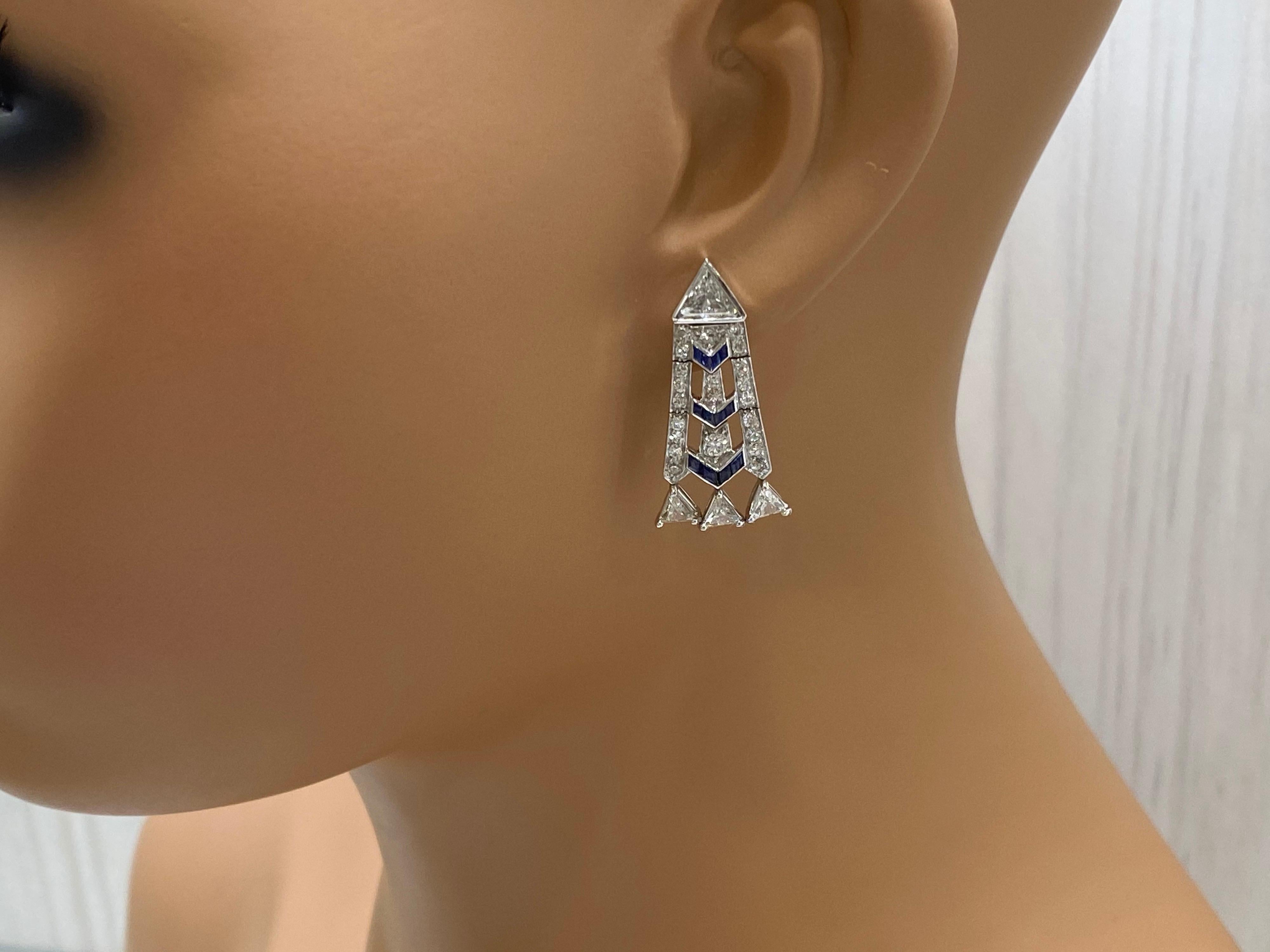 One of a kind is our specialty. These Mindi Mond exclusive are earrings derived from the Art Deco period and lovingly updated in 2019 for contemporary wear. 
They are elegant and chic at the same time. The dangling triangular diamonds dangling from
