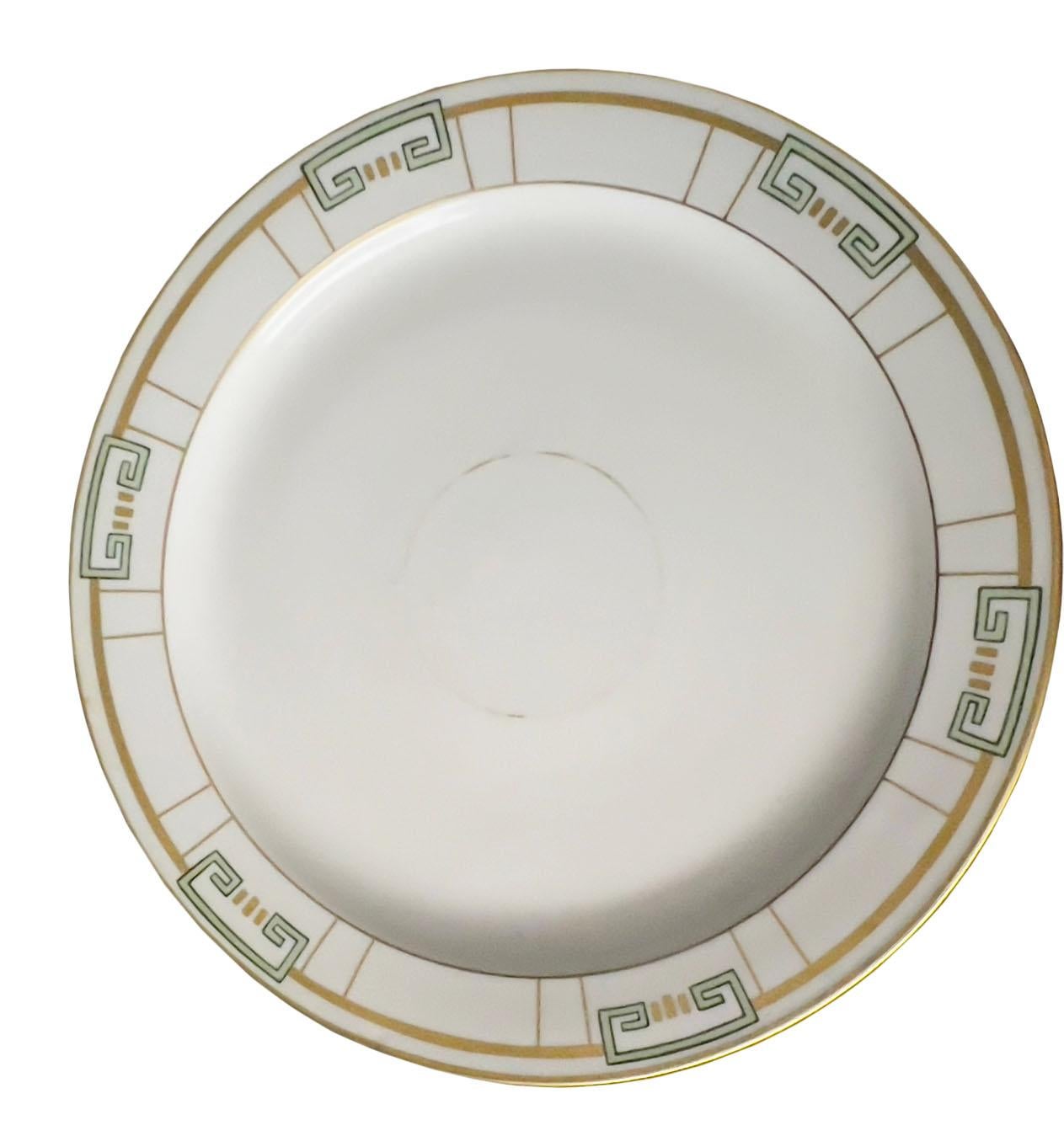 A large round art deco design platter with a geometric green and gold design. The platter is signed Haviland France, and the artist name S. Carpenter.. Perhaps a custom piece.