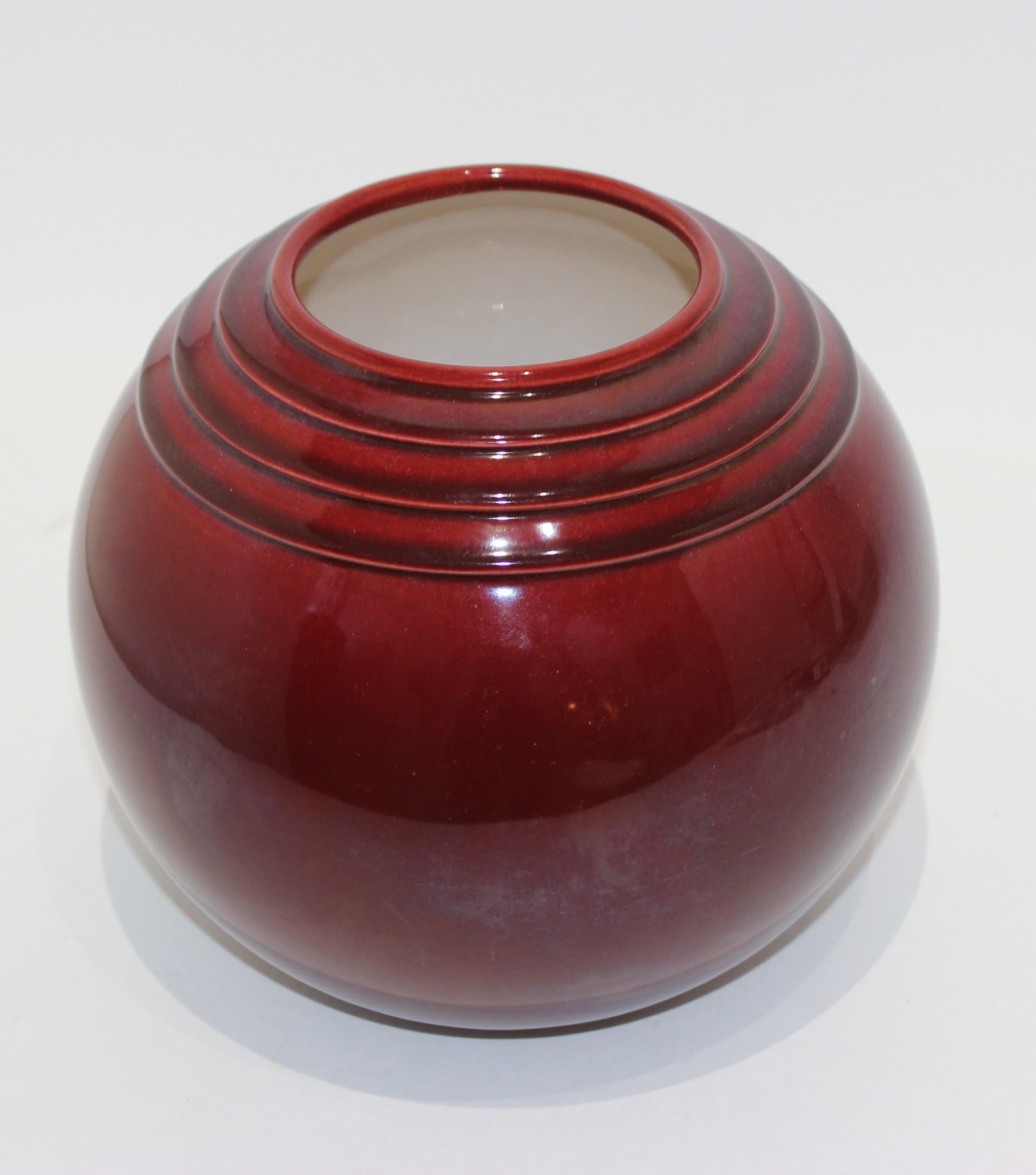 Burgundy color French Art Deco 1930s ceramic vase by PM-Sevres France.
Sold by Ovington's NY.