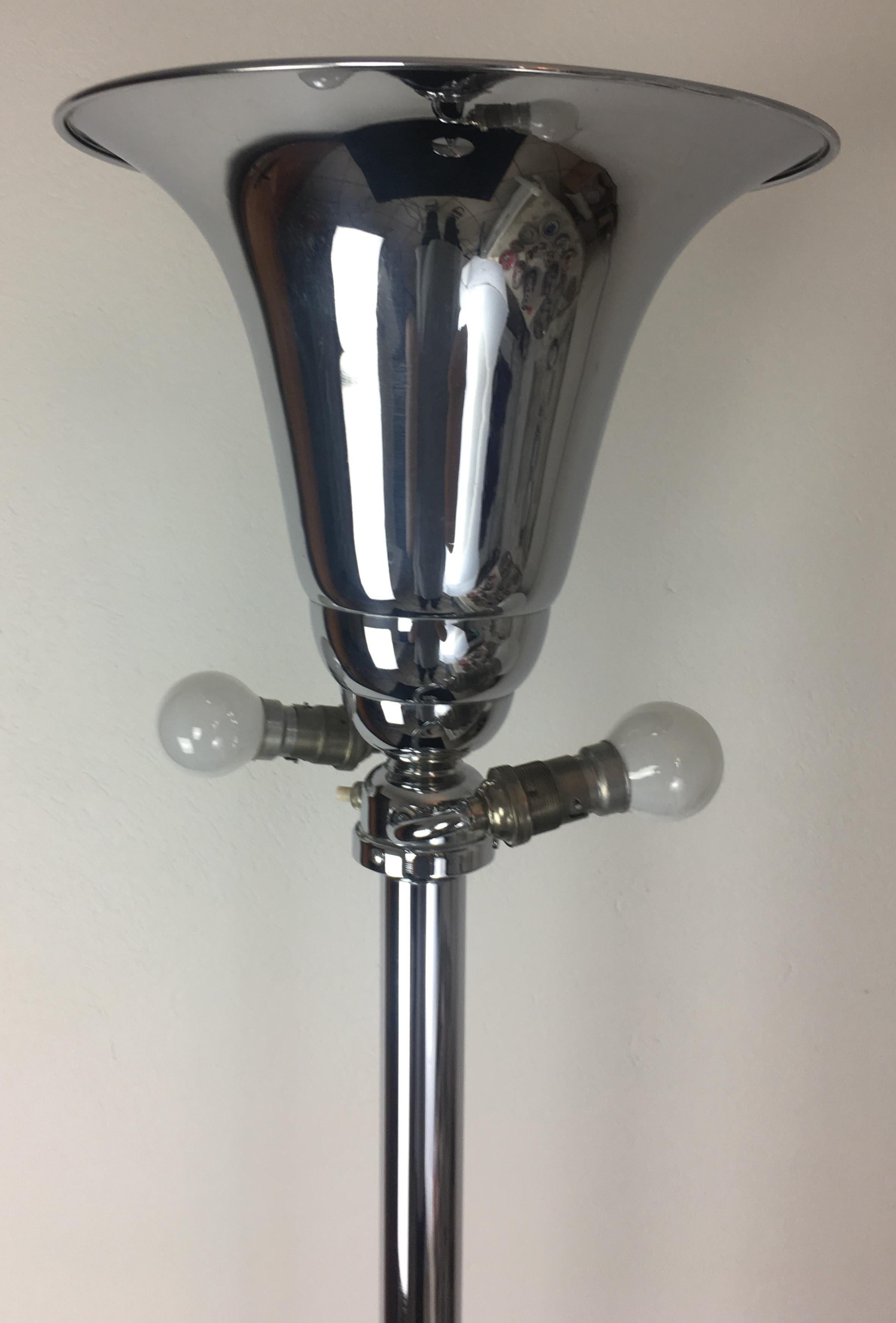 This polished chrome French Art Deco style floor lamp embodies the style and movement of the period.

Original wiring, easily adjustable for use in select destination.  
