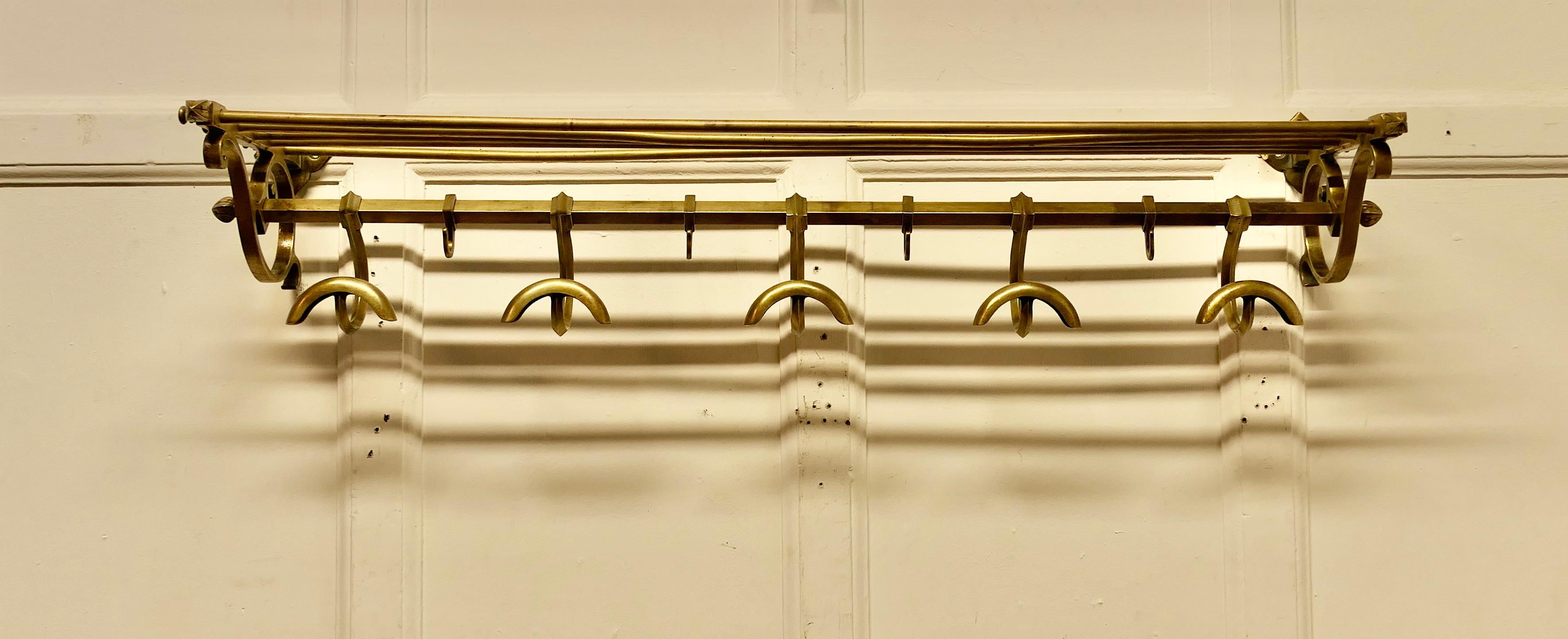 French Art Deco Pullman Hat and Coat Shelf From a Train 

 This Art Deco period brass train rack includes 5 large sliding coat hooks and 4 smaller hooks with an upper railed shelf 
Originally used in a French railway compartment just like the ones