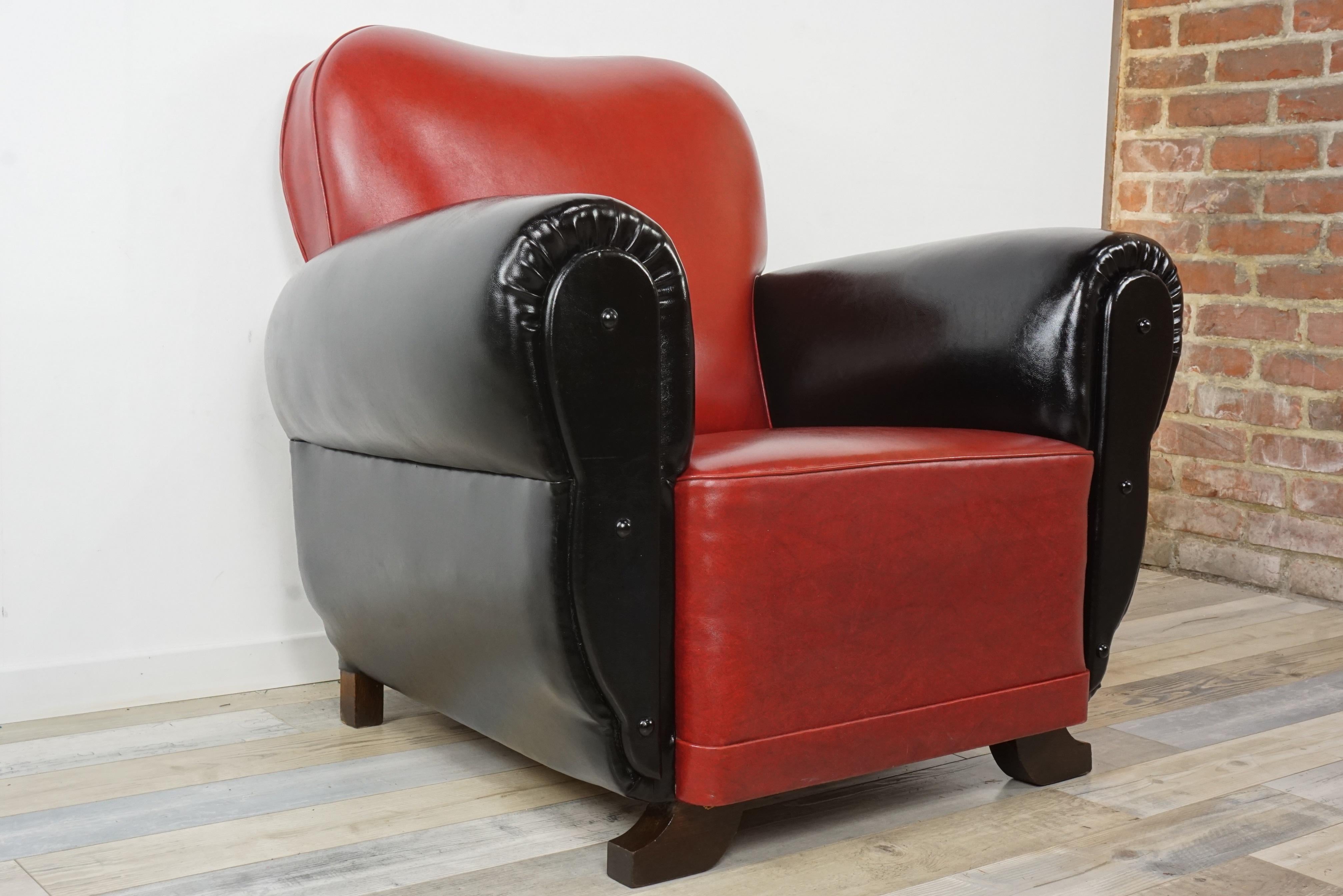 French Art Deco large club armchair in red and black faux leather, comfortable, typical, and welcoming, in very good condition for his great age.
