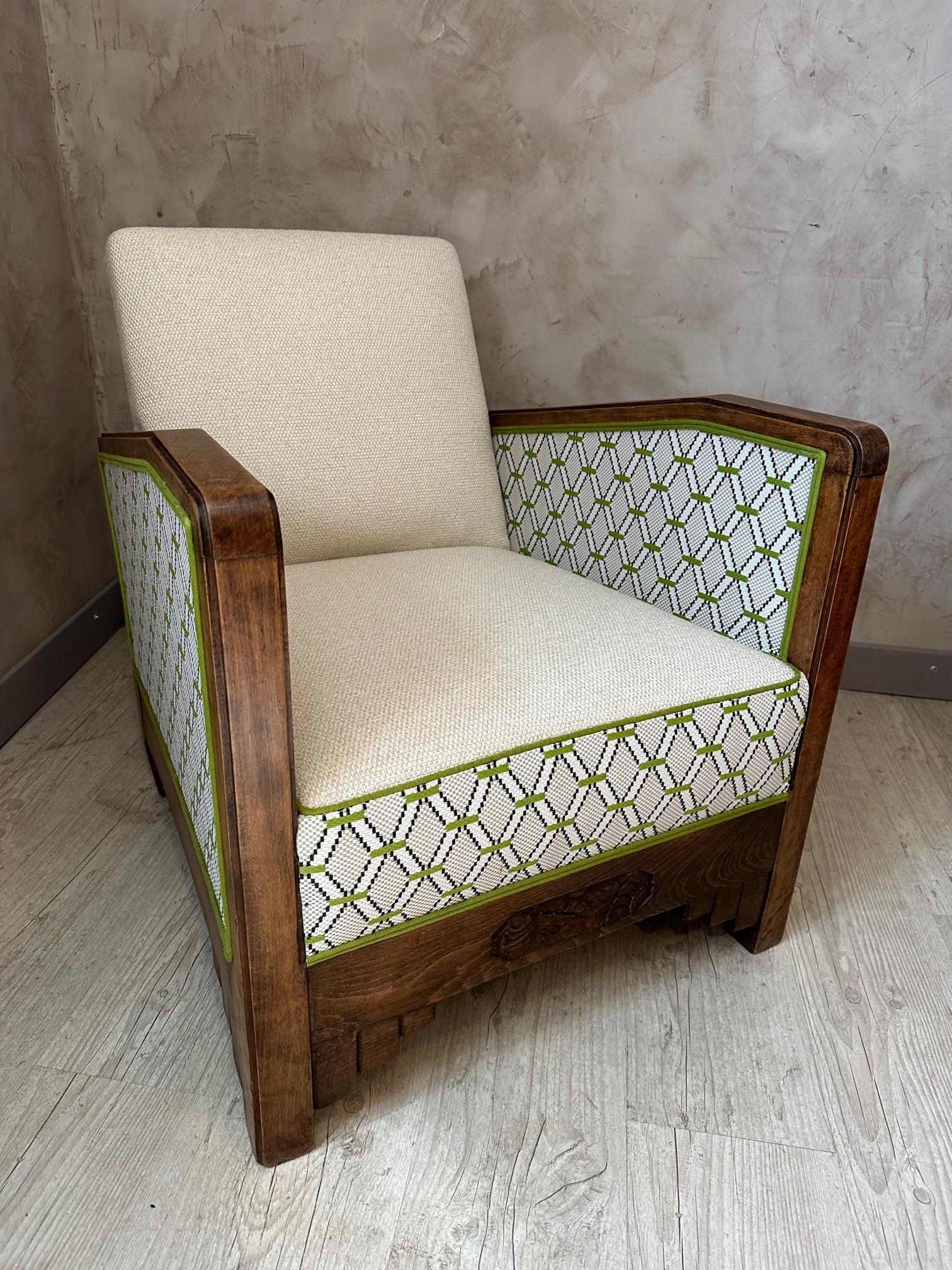 Very nice club-style Art Deco armchair which has been completely redone by us (we are upholsterers) with a very nice outdoor fabric from Nobilis. 
We put a beige fabric on the interior backrest and the seat and a beige and green graphic fabric on