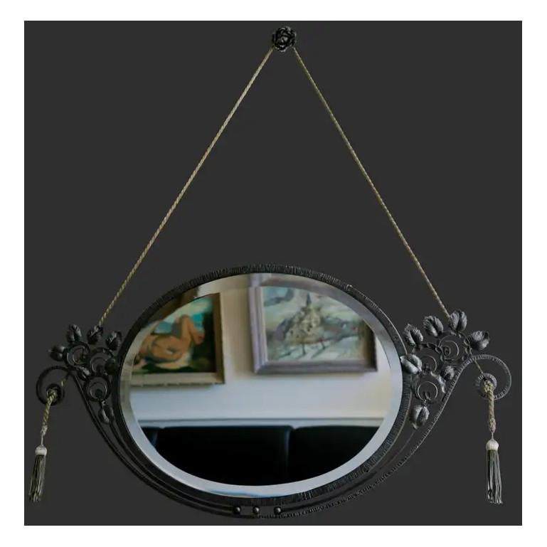French Art Deco wall mirror, France, ca.1925. Wrought-iron and mirror. Rosebush. Original beveled glass in very good condition. Width: 37.4