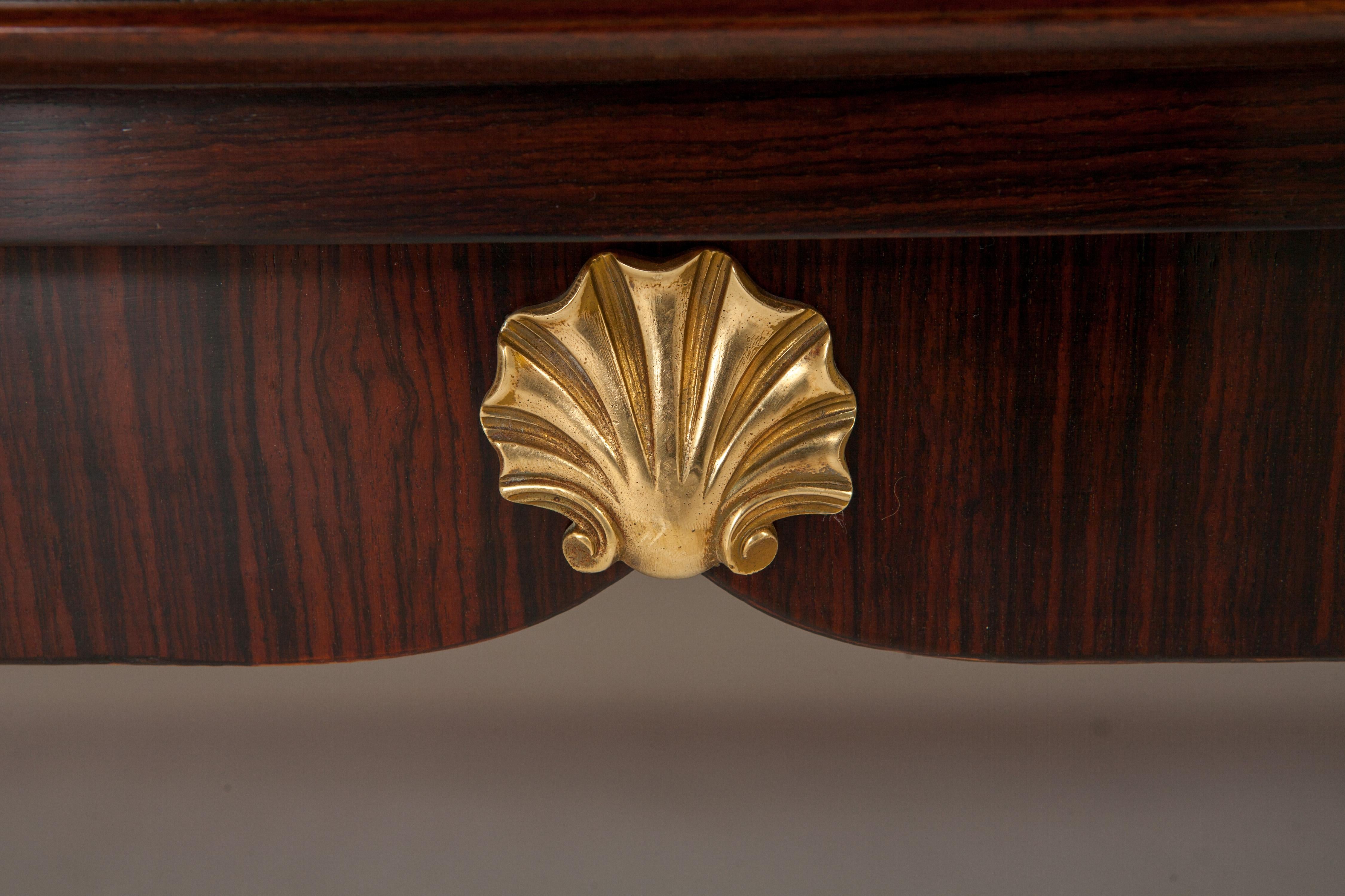 Attractive French, 1940s, three compartment sideboard with rosewood veneer. Lozenge-patterned decor on outer doors and starburst pattern on centre door. Whole piece accented with mother of pearl and brass details. Sycamore interior.