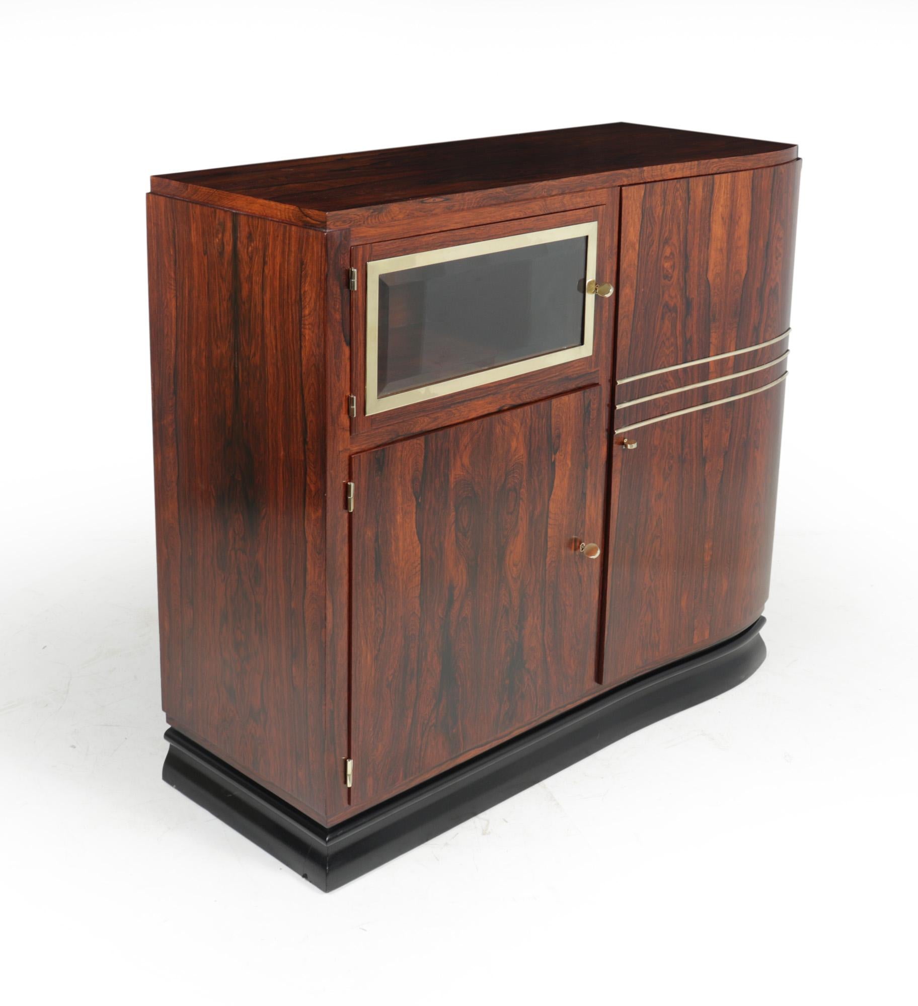 French Art Deco rosewood cabinet c1925
An excellent quality cabinet in rosewood with polished brass detail, working locks with three keys supplied the cabinet has three doors one of these has bevelled glass with brass surround, the cabinet has been