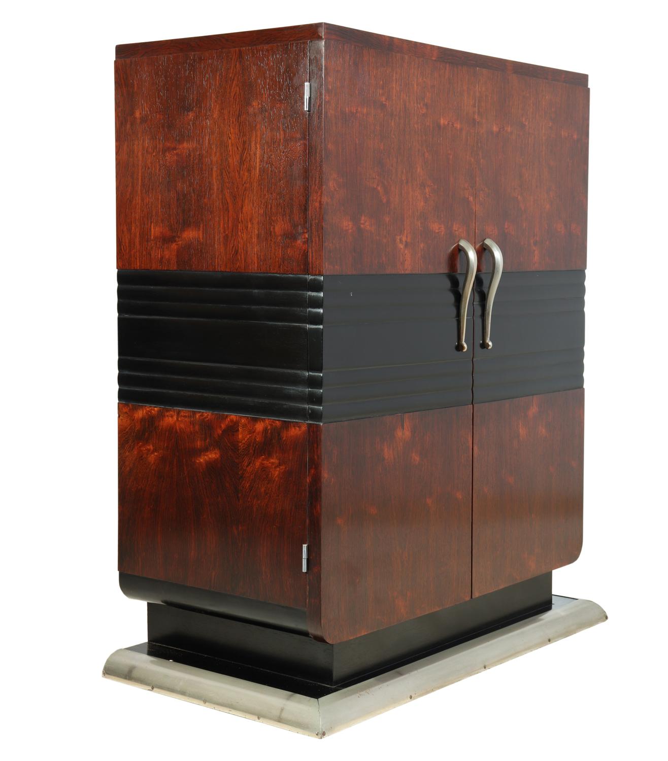 French Art Deco rosewood cocktail cabinet, circa 1930
Original, French Art Deco Rosewood 2-door cocktail cabinet from the 1930's. This cabinet has a central fluted ebonised band, pewter handles and matching base trim. Inside there is a pullout /