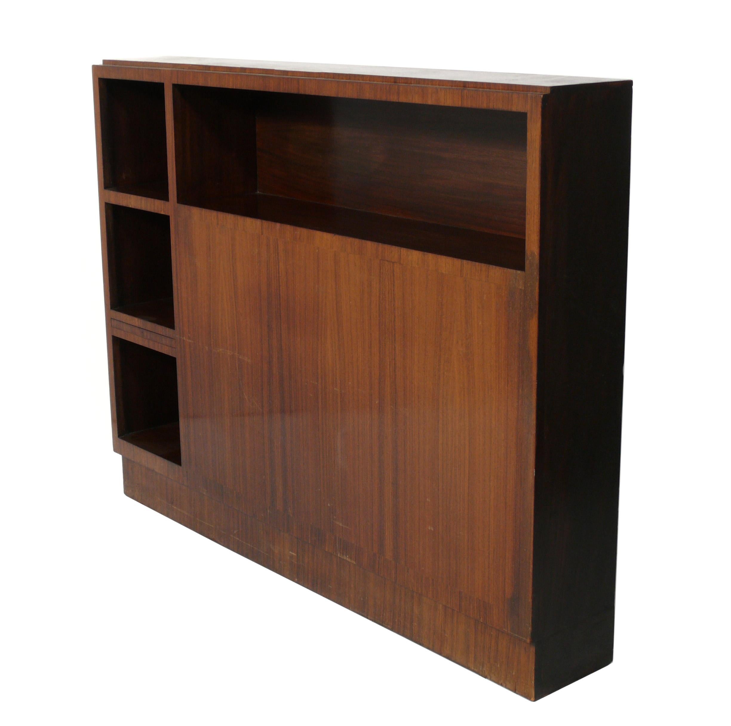 French Art Deco rosewood headboard or bookcase, France, circa 1930s. This piece is currently being refinished and will look incredible when completed. The price noted includes refinishing. This piece is a versatile size and was probably originally