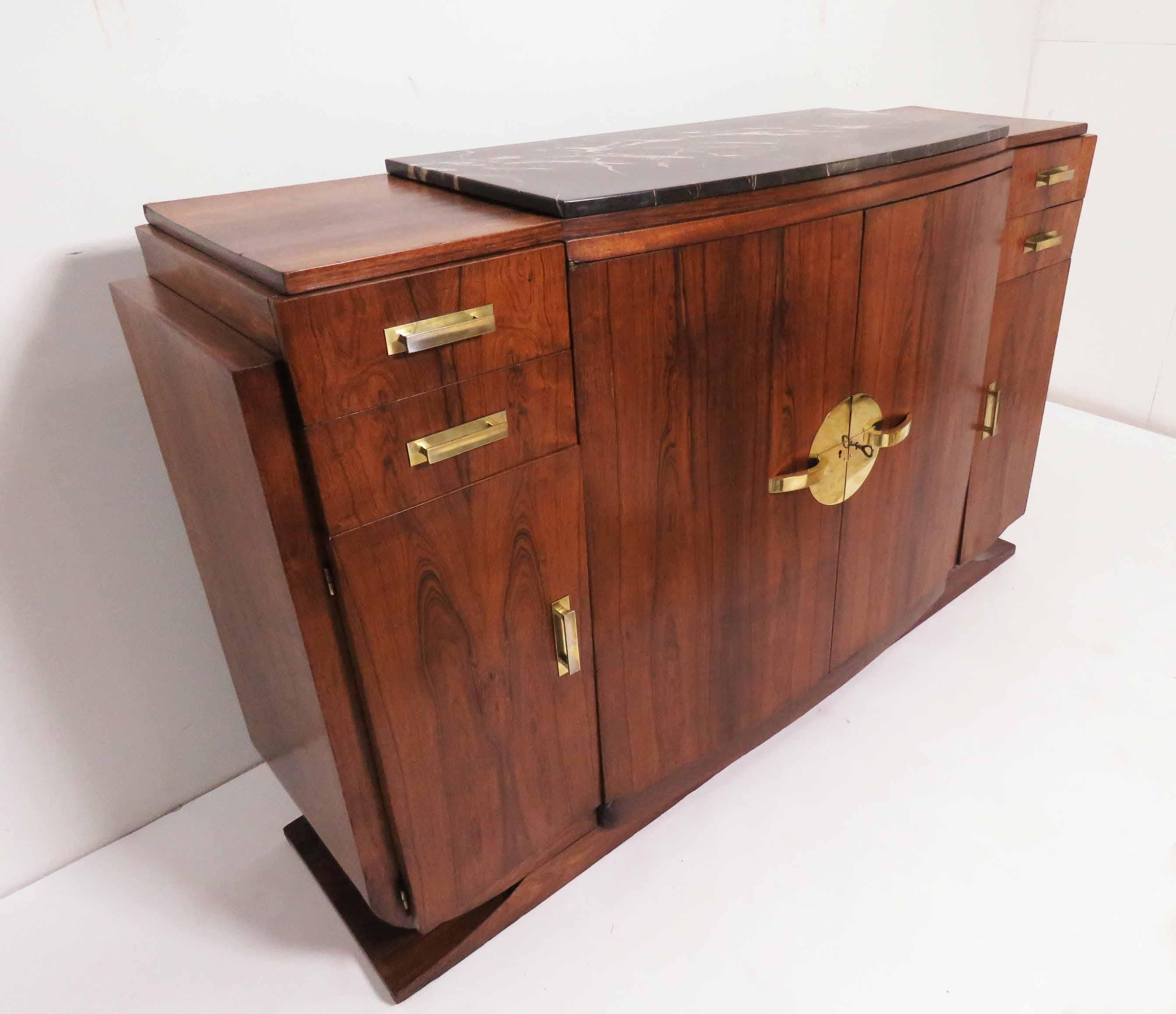 A majestic Art Deco buffet cabinet in rosewood with brass hardware, in the style of Jules Leleu. Step 
