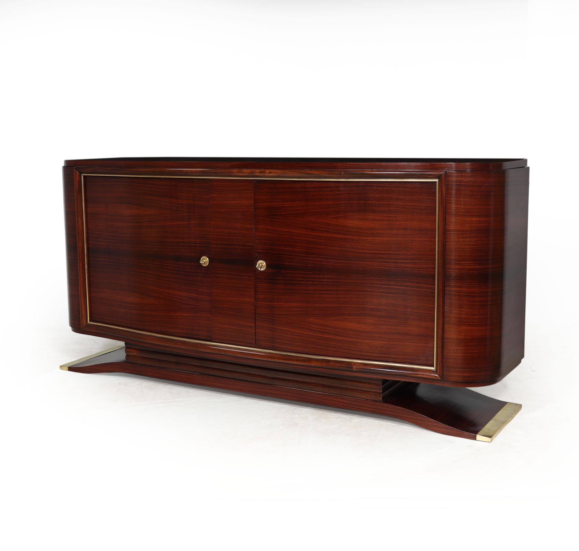 FRENCH ART DECO SIDEBOARD BY MARCEL CERF
This stunning French Art Deco Sideboard in Rosewood is an exquisite piece of furniture that leaves a lasting impression. Handcrafted from rosewood, it showcases two elegantly serpentine shaped doors adorned