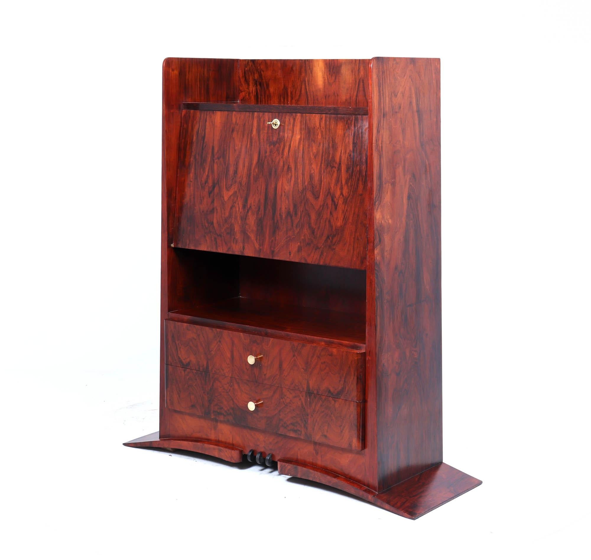 Secrétaire Desk, c.1930

A striking French Art Deco secrétaire cabinet, circa 1930, in beautifully figured rosewood with a contrasting sycamore-lined interior. The drop-down writing surface features an inset black leather writing panel with some