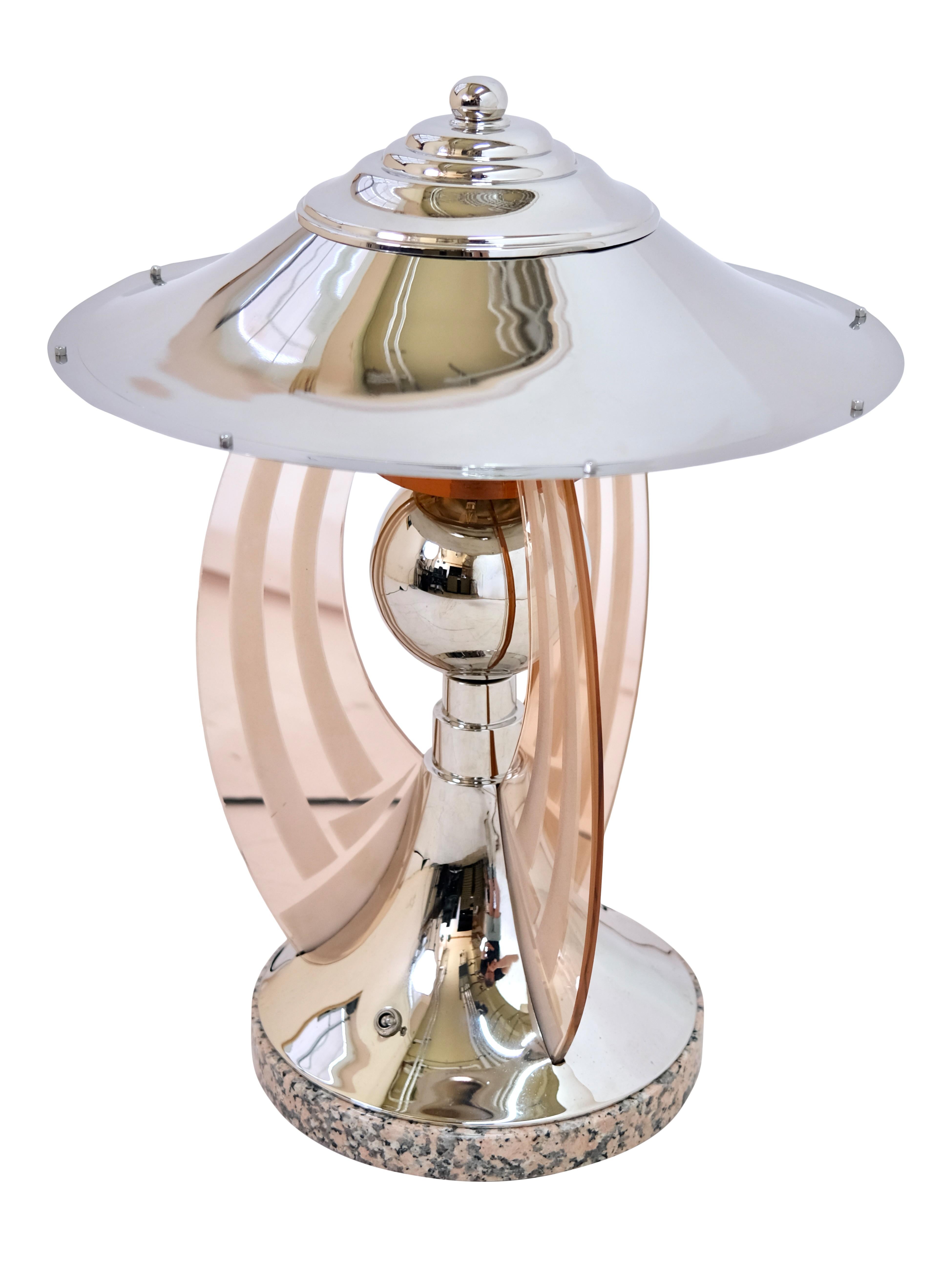 Chrome table lamp with rosaline colored glass arches

Round chrome table lamp
Rosalin colored glass arches
Marble base

Original Art Deco, France 1930s

Dimensions:
Diameter: 45 cm
Height: 55 cm. 
