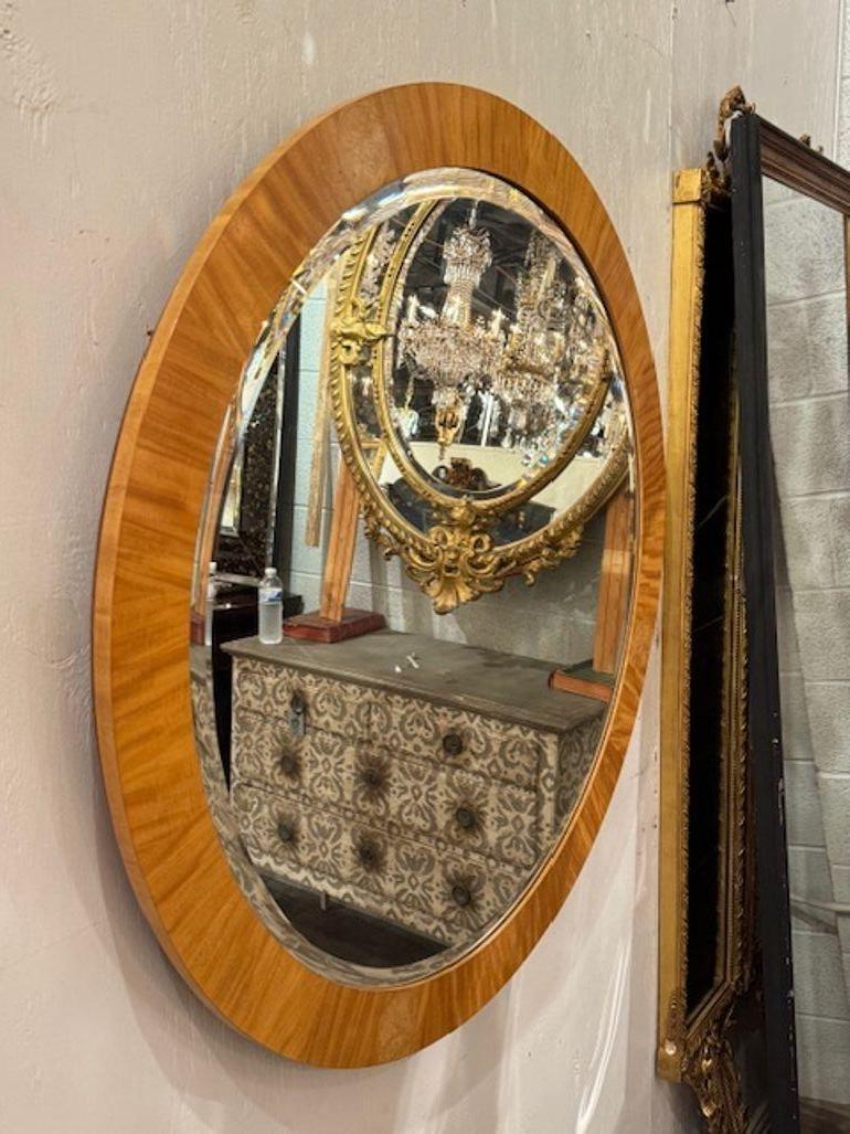 Period French Art Deco round walnut mirror. This is a stunning choice for adding warmth and architectural flair to your space. Circa 1920. 40